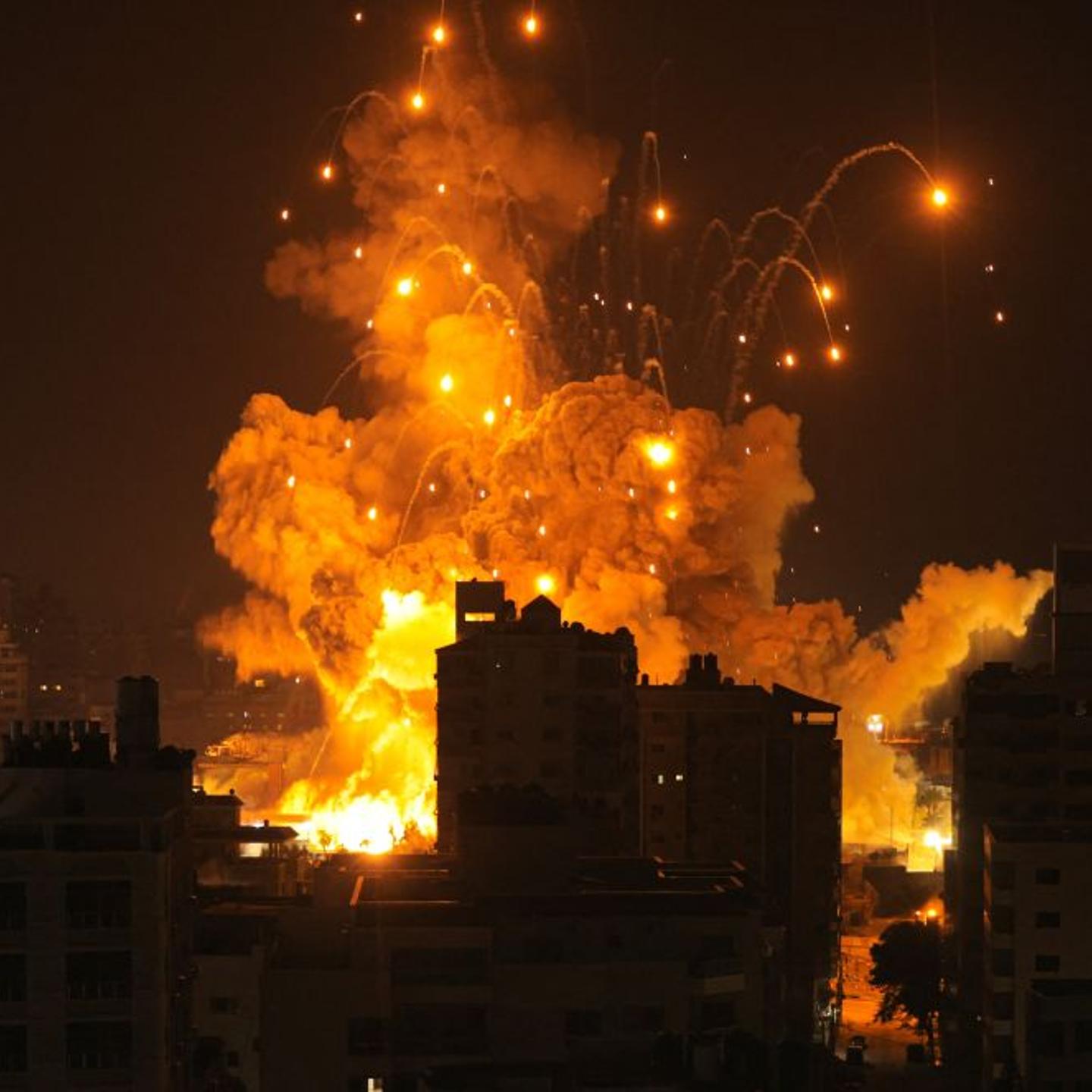 A missile explodes in Gaza City during an Israeli air strike on October 8, 2023. Israel, reeling from the deadliest attack on its territory in half a century, formally declared war on Hamas Sunday as the conflict's death toll surged close to 1,000 after