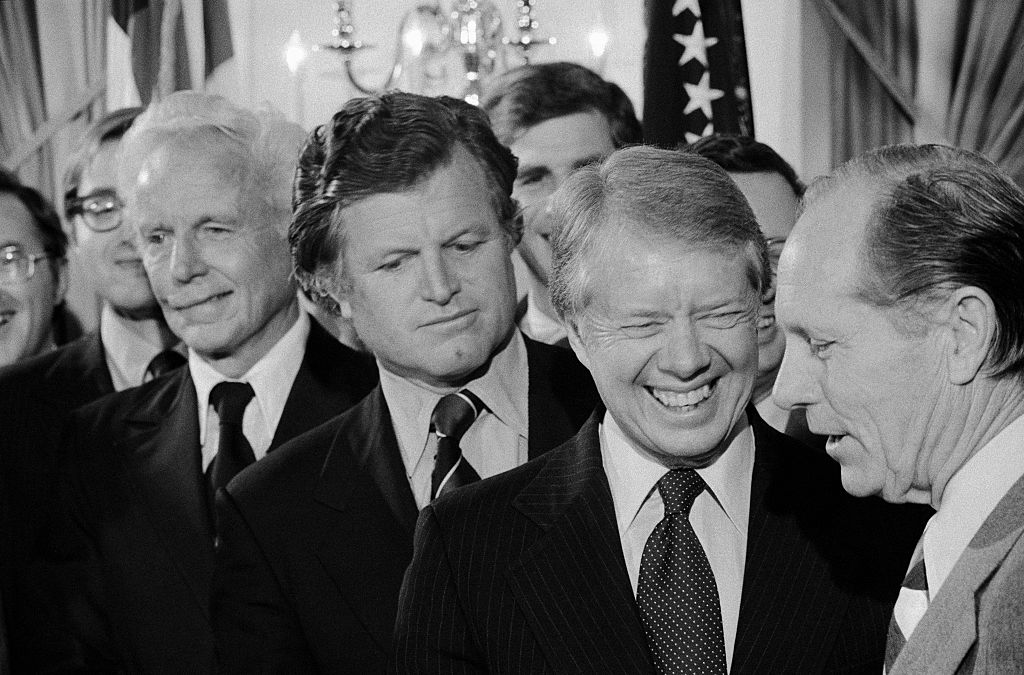 Edward Kennedy Looking on near Jimmy Carter