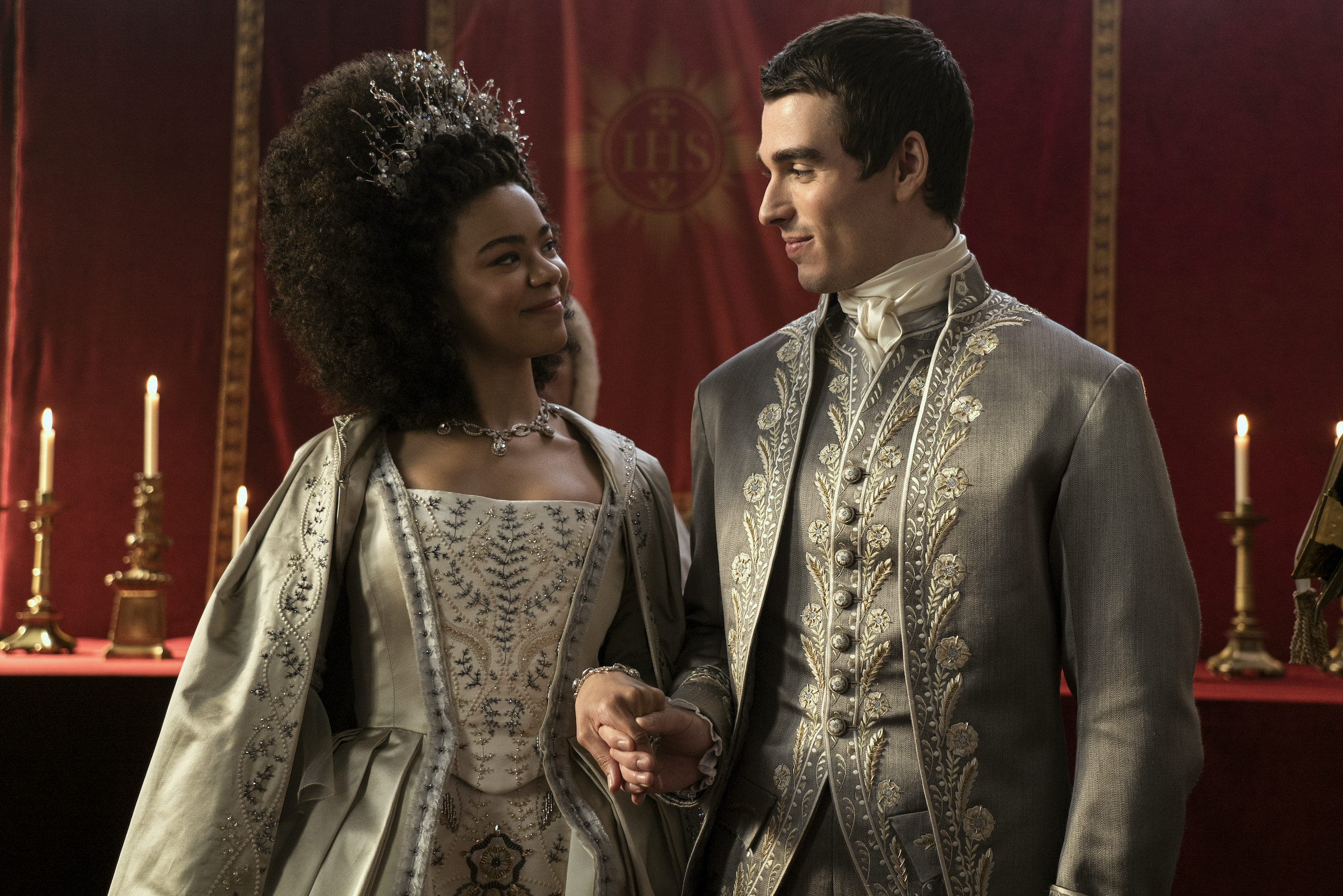 Queen Charlotte (India Amarteifio) and King George III (Corey Mylchreest) at their wedding.