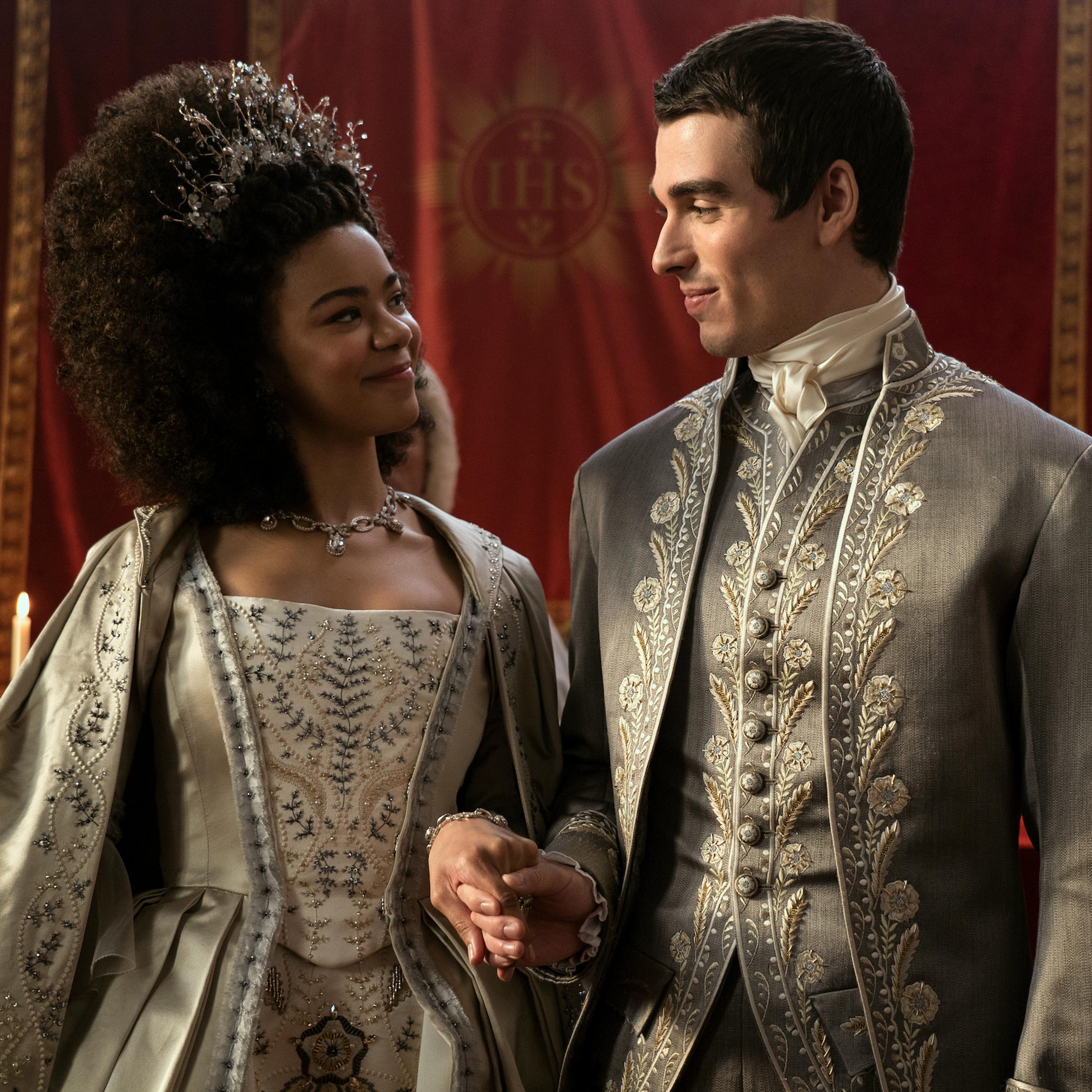 Queen Charlotte (India Amarteifio) and King George III (Corey Mylchreest) at their wedding.