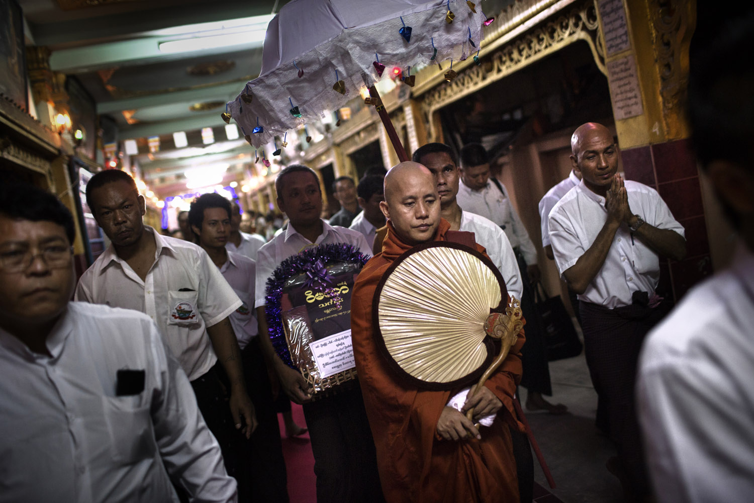 <b><i>The following photographs were taken in May and June 2013.</i></b><br><br>Wirathu, the spiritual leader of the 969 Buddhist Nationalist movement, and his entourage leave after giving a sermon at a monastery in Mandalay, Burma.