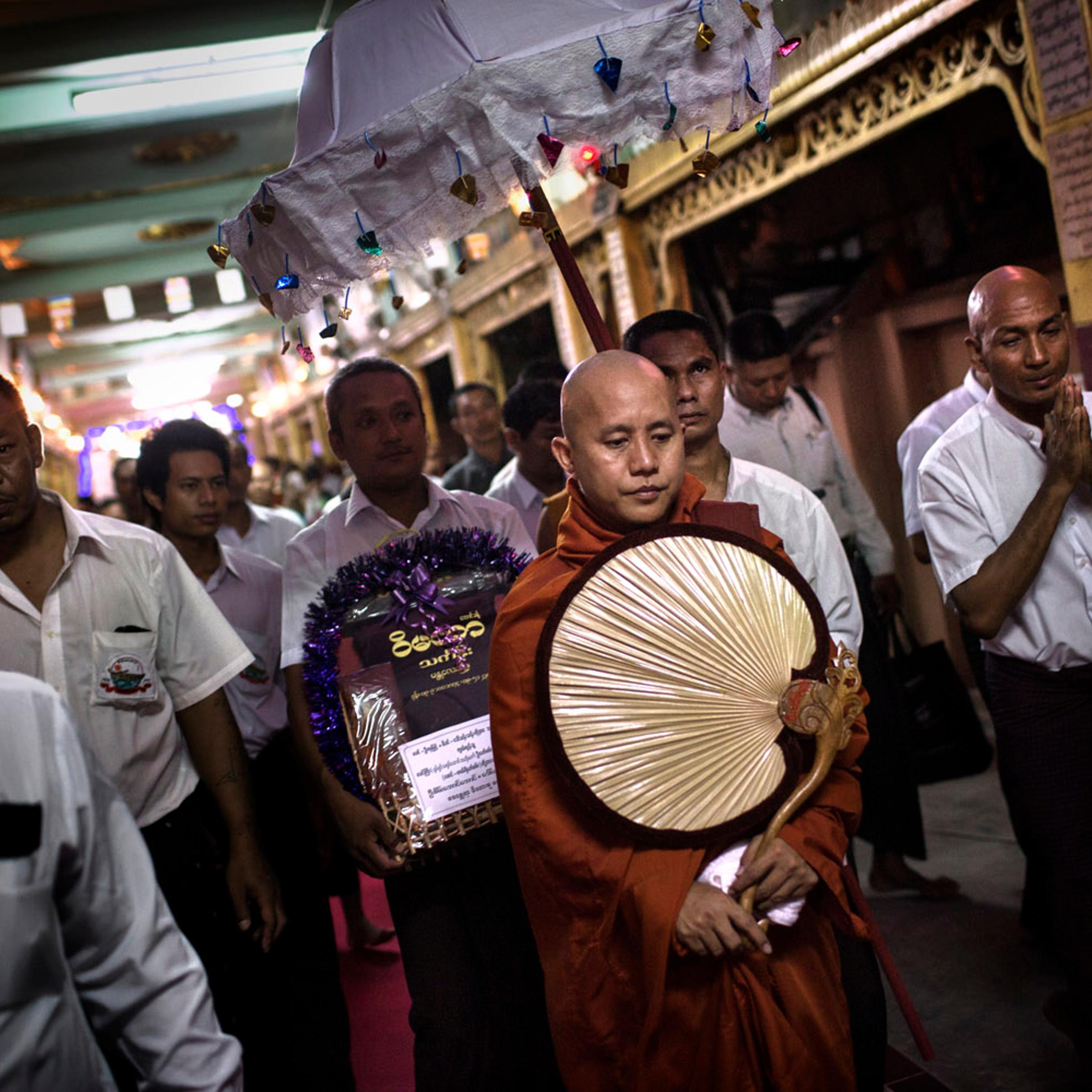 <b><i>The following photographs were taken in May and June 2013.</i></b><br><br>Wirathu, the spiritual leader of the 969 Buddhist Nationalist movement, and his entourage leave after giving a sermon at a monastery in Mandalay, Burma.