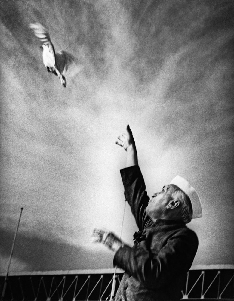 Nehru releasing a dove as a sign of peace at a public function at the National Stadium in new Delhi, mid 1950's
