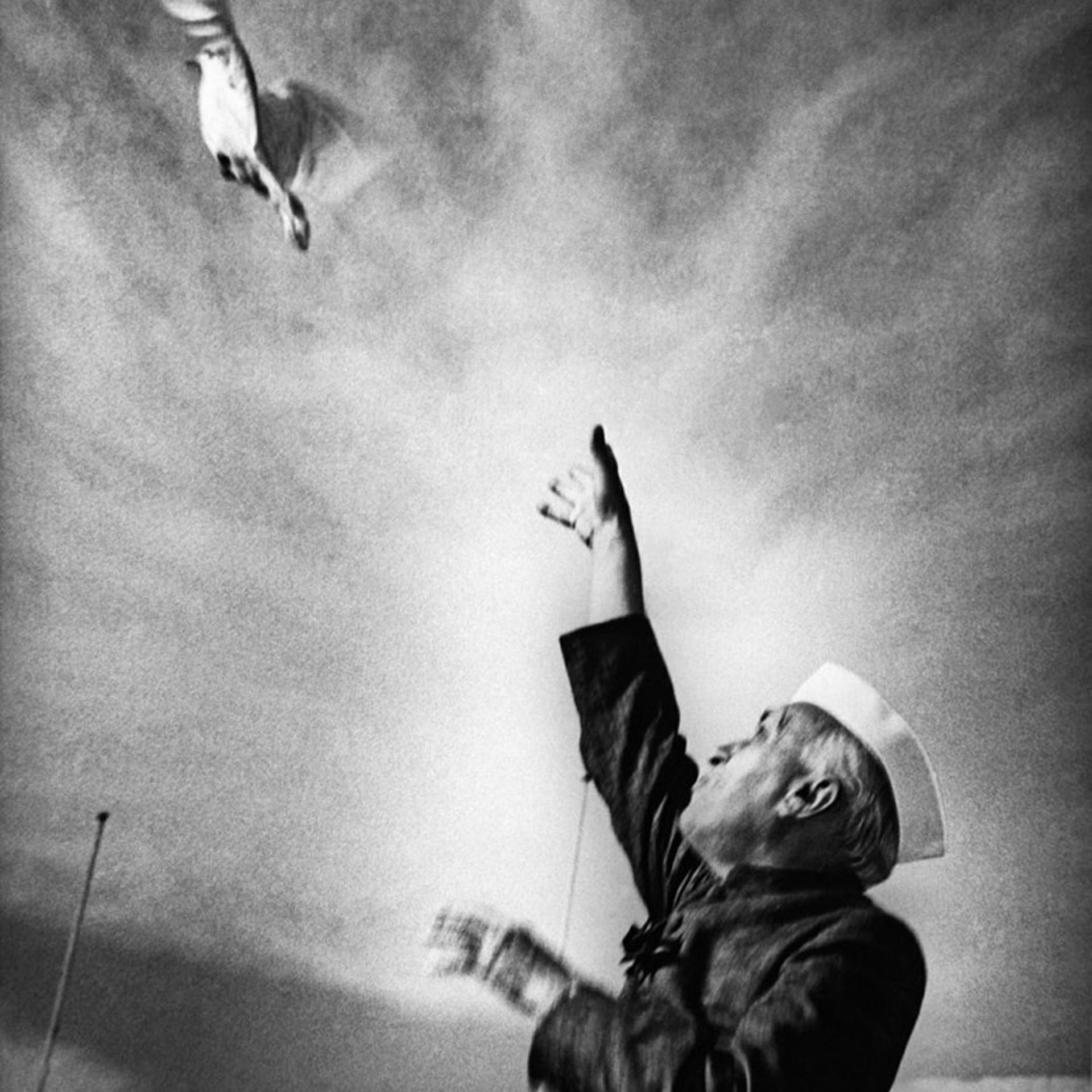 Nehru releasing a dove as a sign of peace at a public function at the National Stadium in new Delhi, mid 1950's