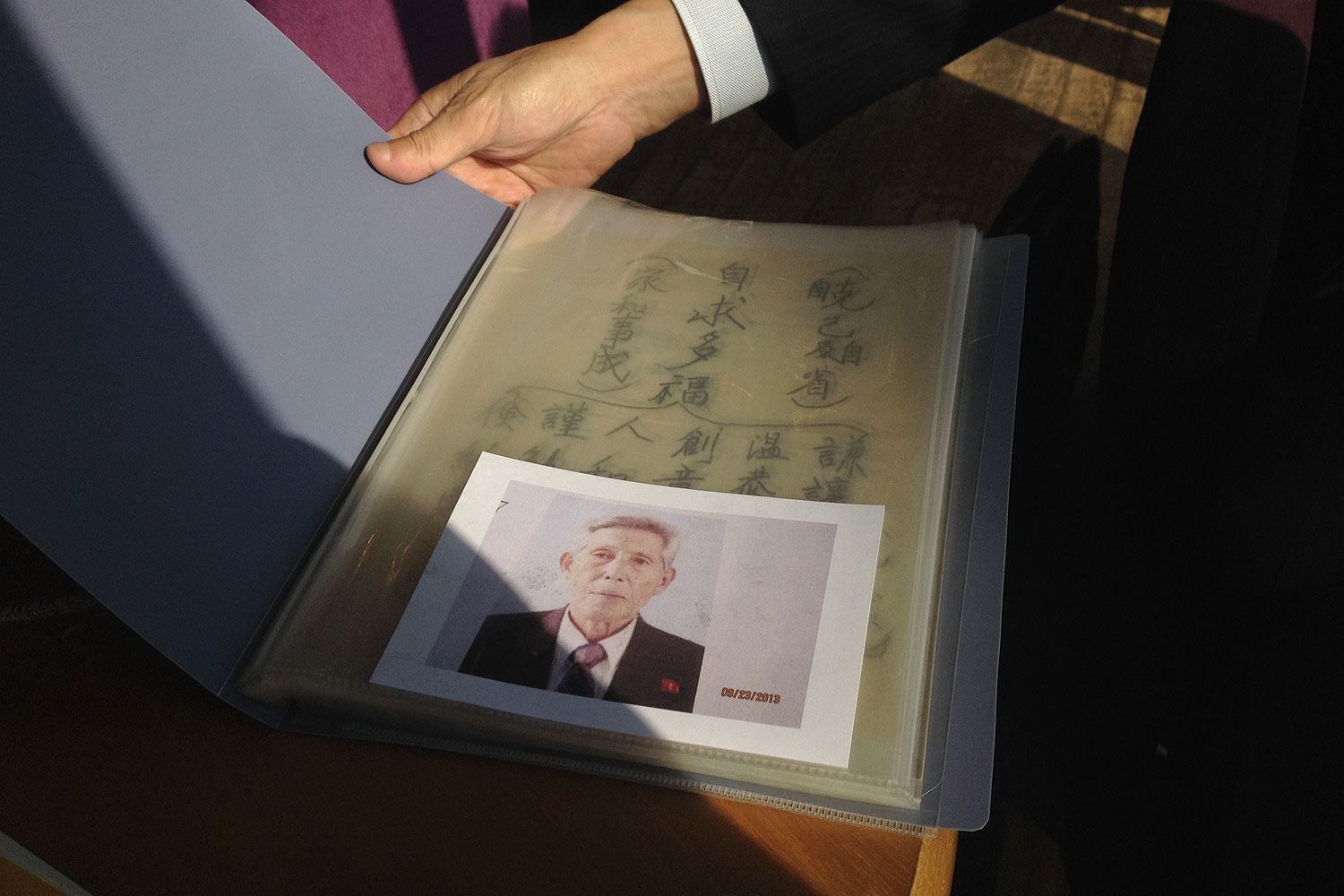 South Korean Kwon Dong-yul, 73, shows a picture of his brother, Kwon Eung-ryul, 88, who lives in North Korea. On Sunday, they were briefly reunited