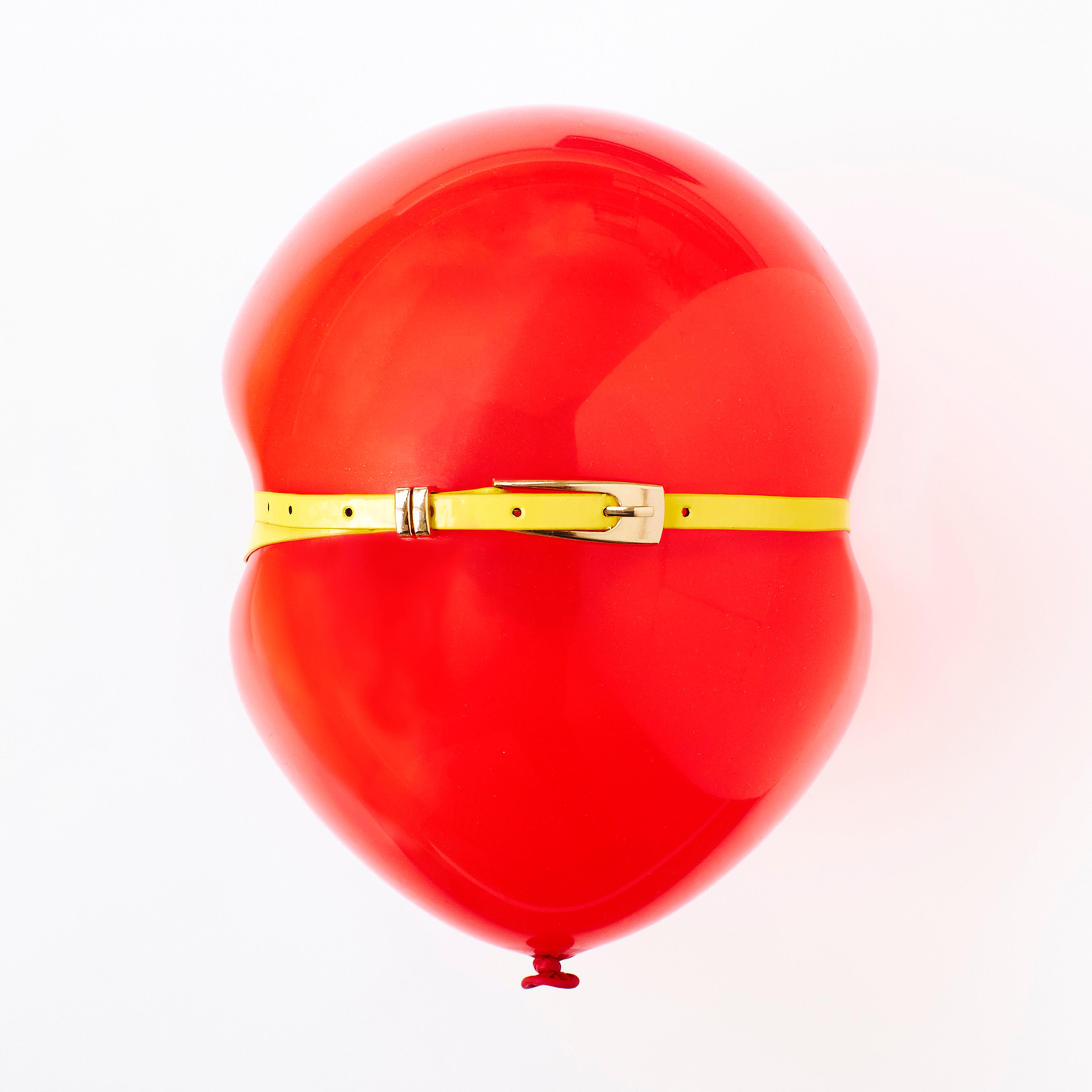 Red balloon, conceptual image of bloated stomach