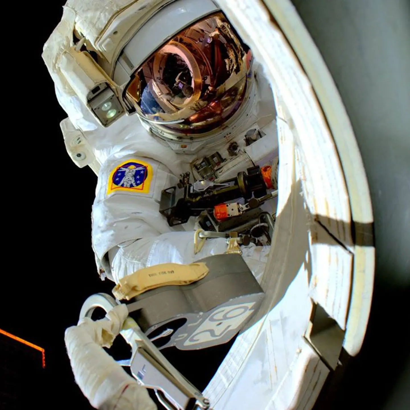Astronaut Scott Kelly, re-entering the International Space Station after his spacewalk on Oct. 29, 2015.