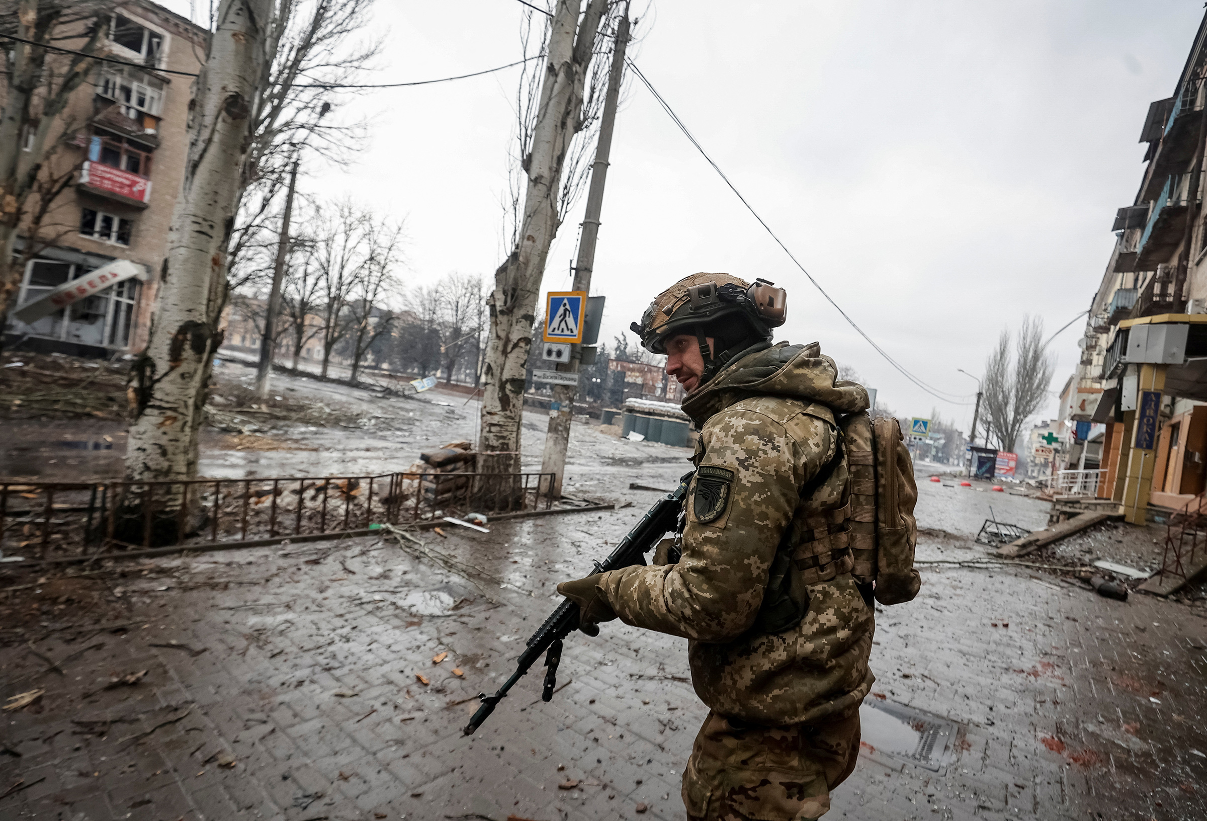 A Ukrainian serviceman walks an empty street, as Russia's attack on Ukraine continues, in the front line city of Bakhmut, in Donetsk region, Ukraine, on Feb. 25.