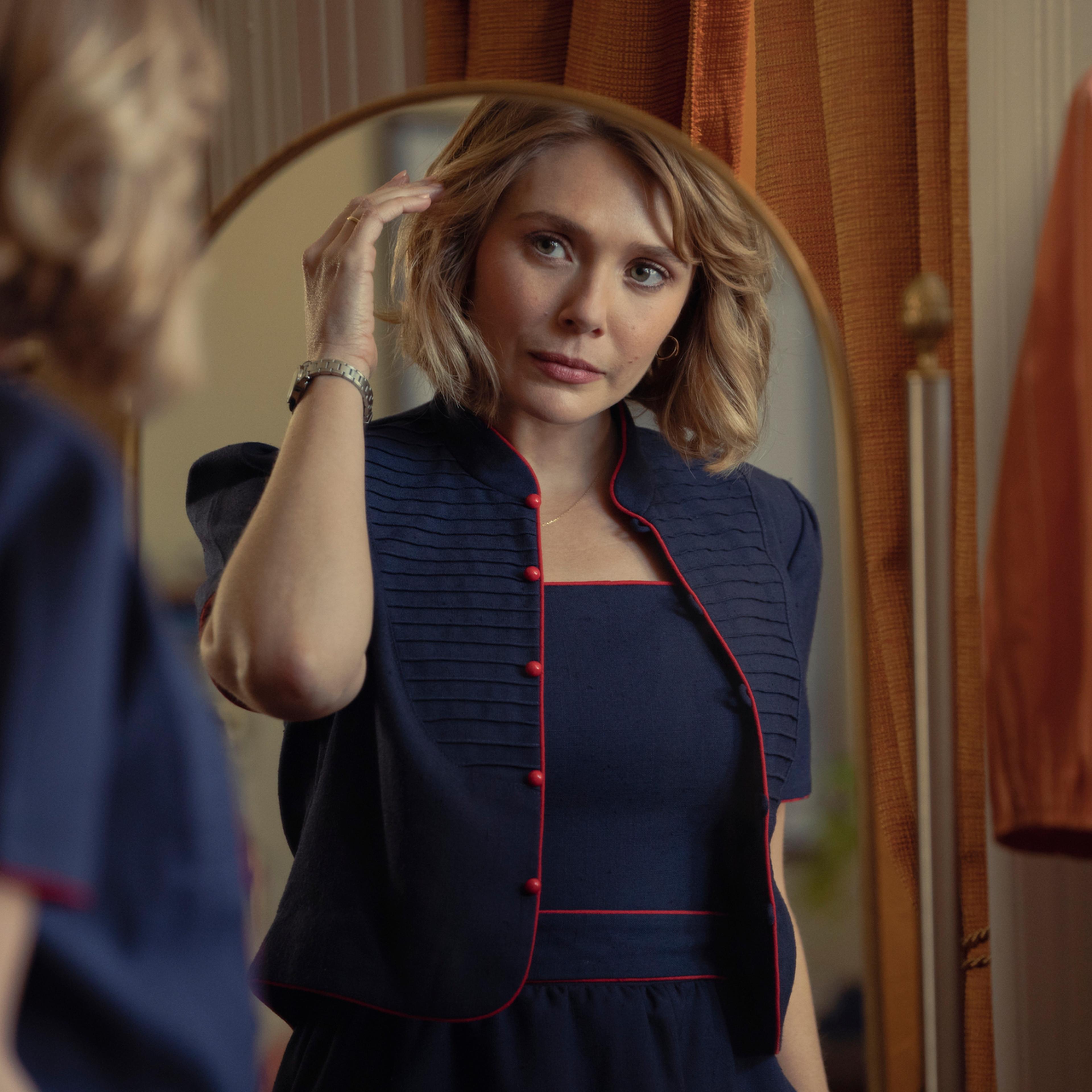 Elizabeth Olsen looking in a mirror