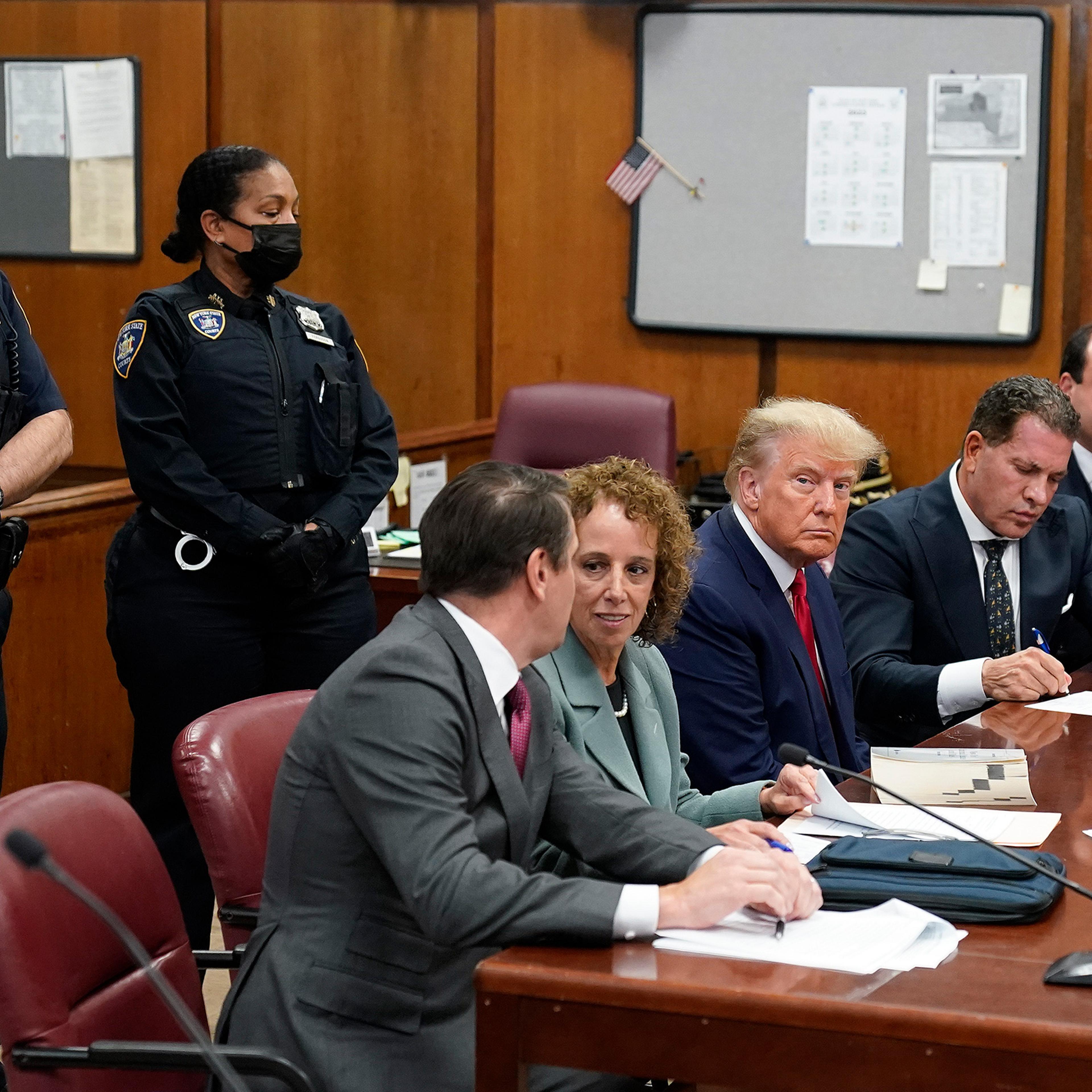 Former President Donald Trump sits at the defense table with his defense team in a Manhattan court April 4, 2023, in New York.