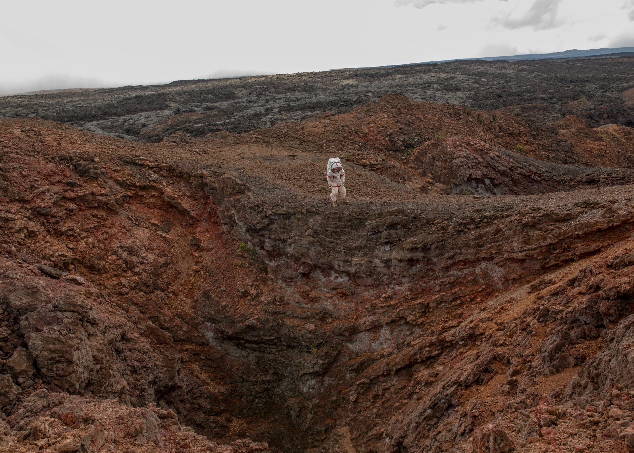 Carmel Johnston, Crew Commander for Mission 4, reenacts a spacewalk in a lava field near the HI-SEAS habitat on the island of Hawaii on Aug. 29, 2016. The crew emerged from 365 days in isolation on Aug. 28.