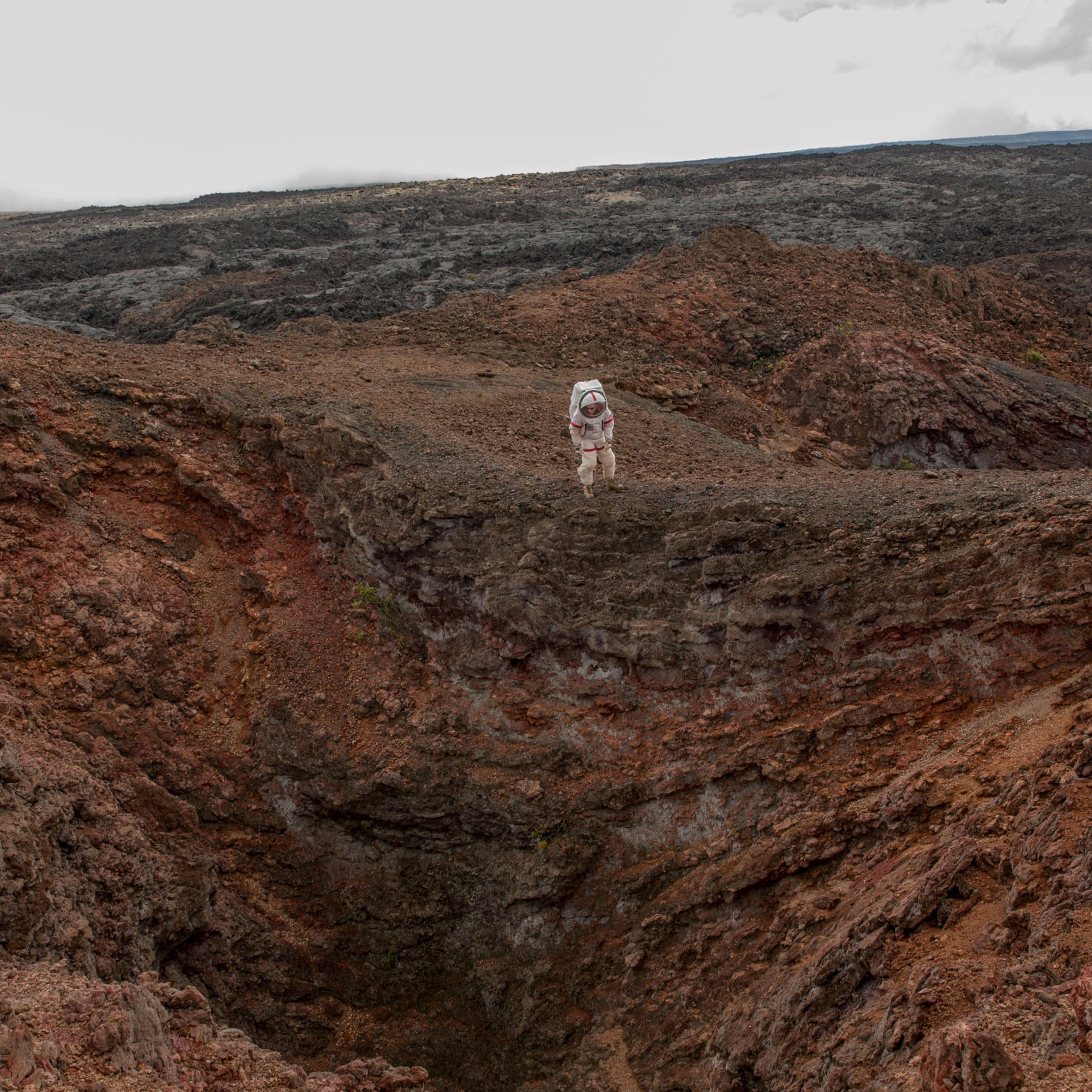 Carmel Johnston, Crew Commander for Mission 4, reenacts a spacewalk in a lava field near the HI-SEAS habitat on the island of Hawaii on Aug. 29, 2016. The crew emerged from 365 days in isolation on Aug. 28.