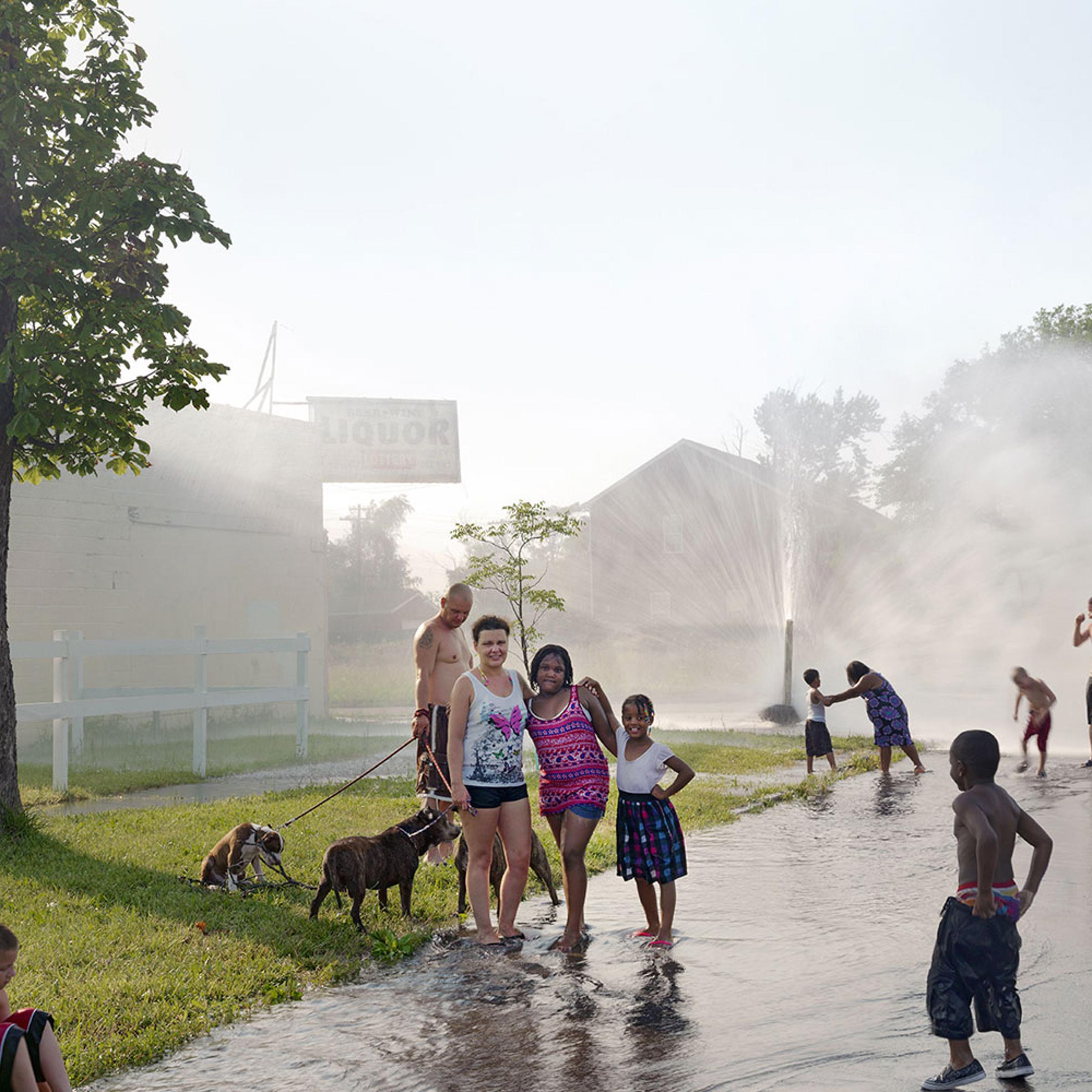 <i>A Neighborhood Group Playing in the Street</i>, North Corktown, Detroit, 2012
<br /><br />
<i>The temperature hit 103 degrees on this July day, forcing many neighborhood residents to open up fire hydrants to relieve themselves from the sweltering heat.</i>