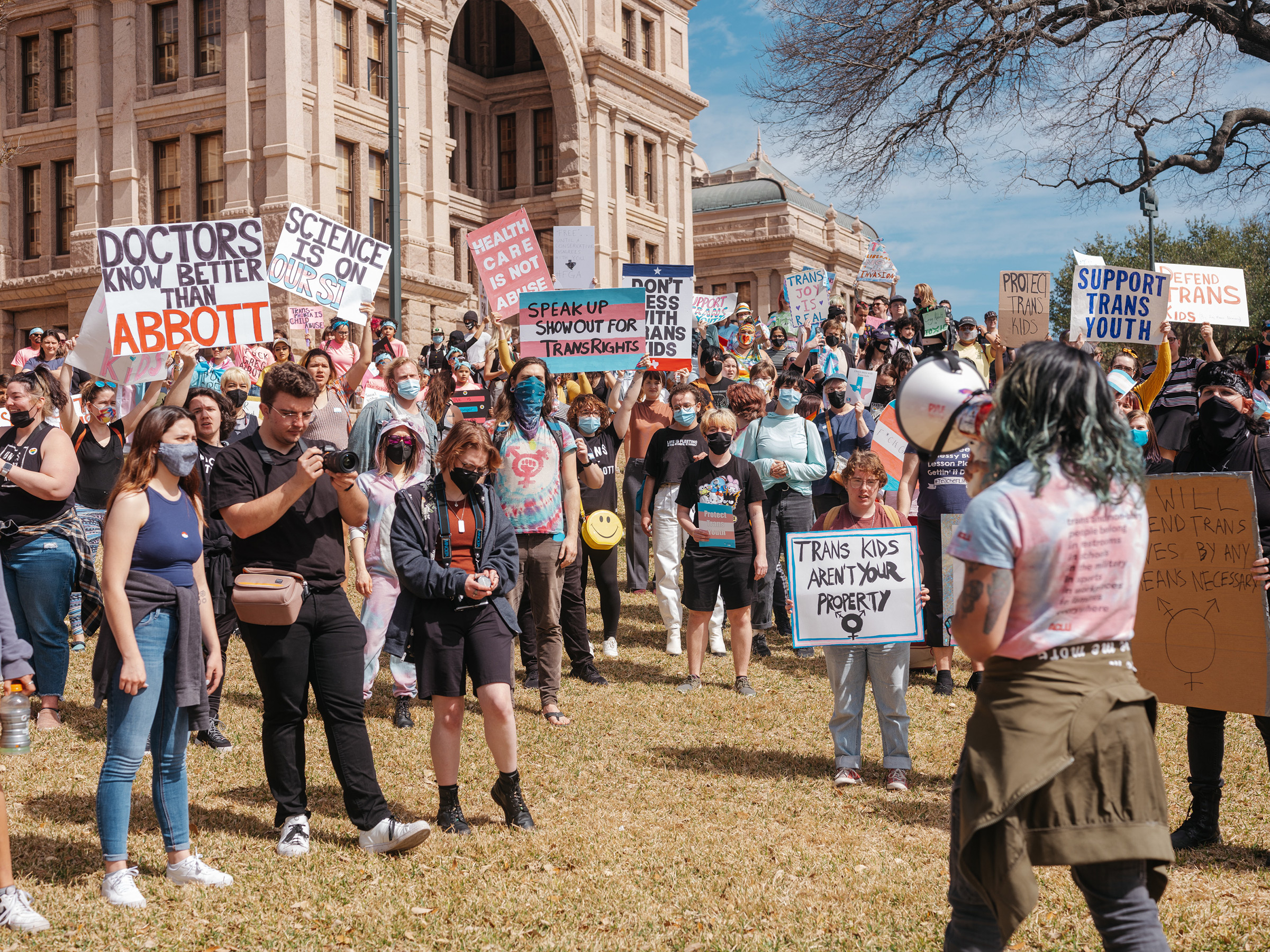 Demonstrators protest a Texas policy to regard gender-affirming treatments for transgender youth as "child abuse," at the State Capitol in Austin, March 1, 2022. 