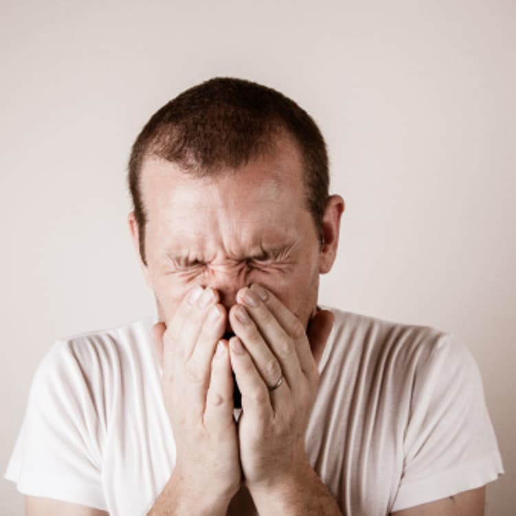 man-sneezing