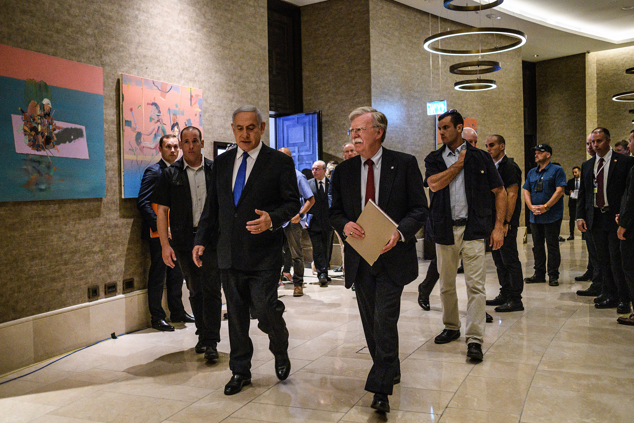 U.S. National Security Adviser John Bolton walks with Israeli Prime Minister Benjamin Netanyahu in Jerusalem in June. Netanyahu met with Bolton, and his Russian counterpart, regarding subjects like Iran and the troops it has in Syria, which Israel border