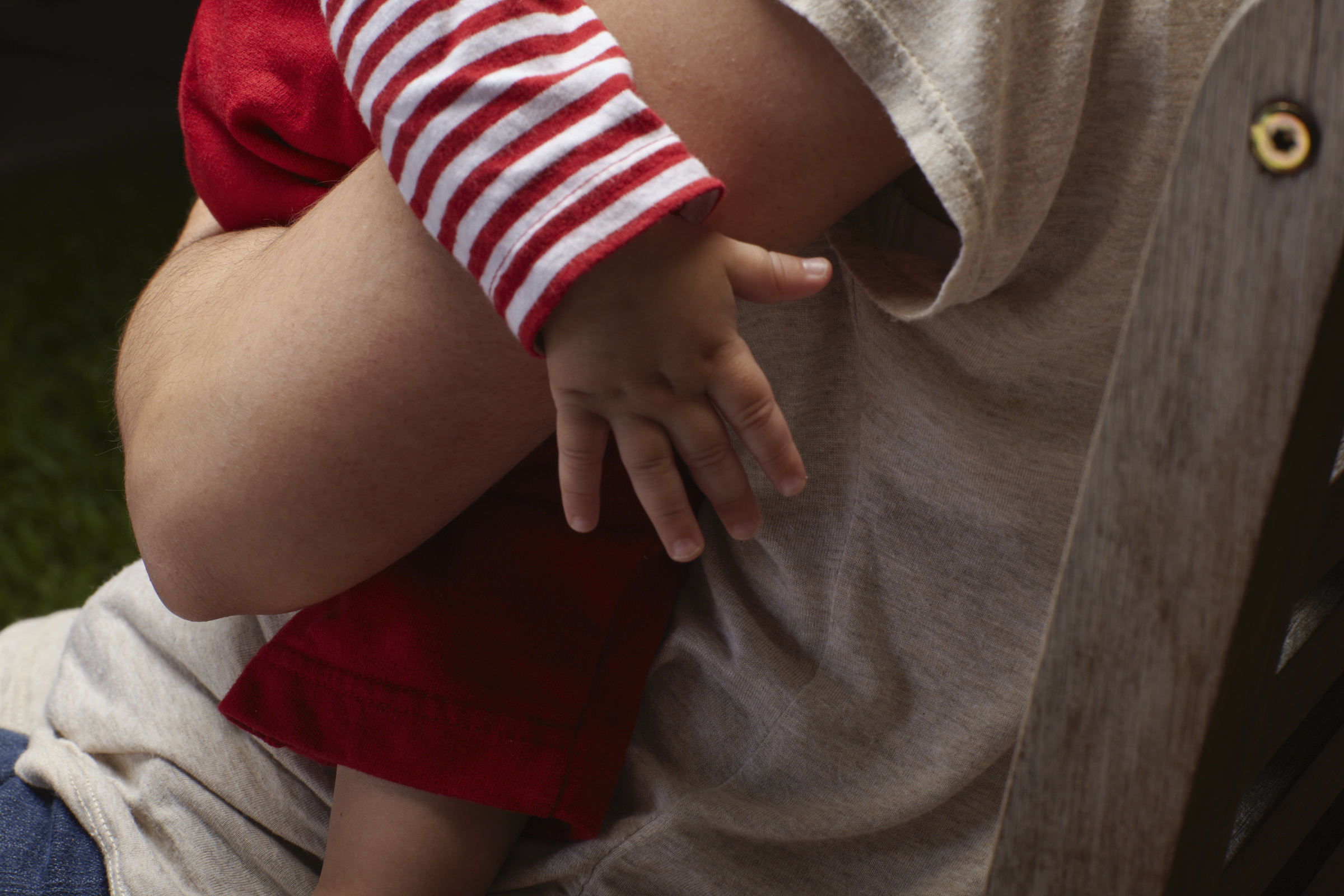 A parent holds their young child