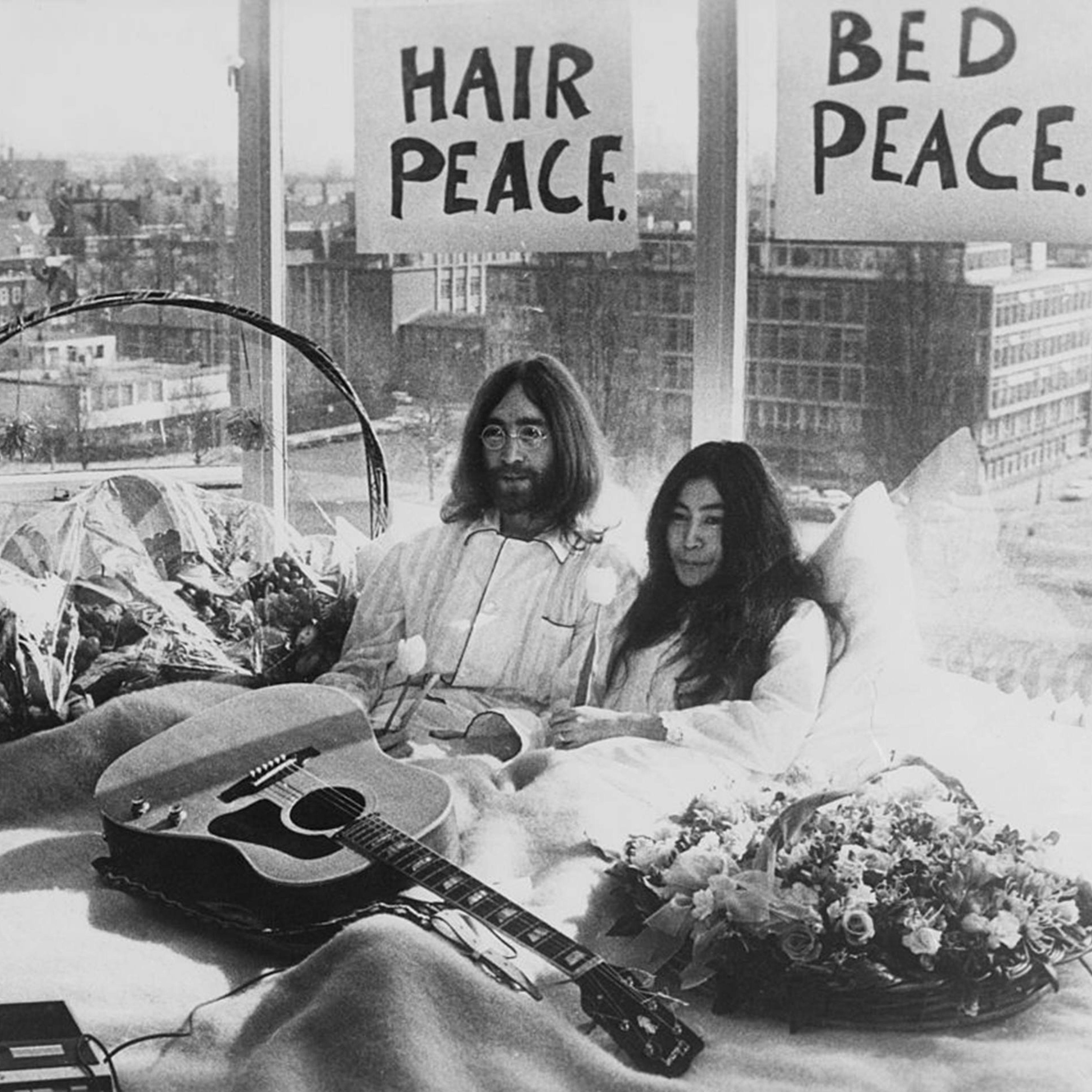 Newly-weds John Lennon of The Beatles and artist Yoko Ono kick-off a bed-in for peace on Mar. 25, 1969, in their suite at the Hilton Amsterdam in The Netherlands.