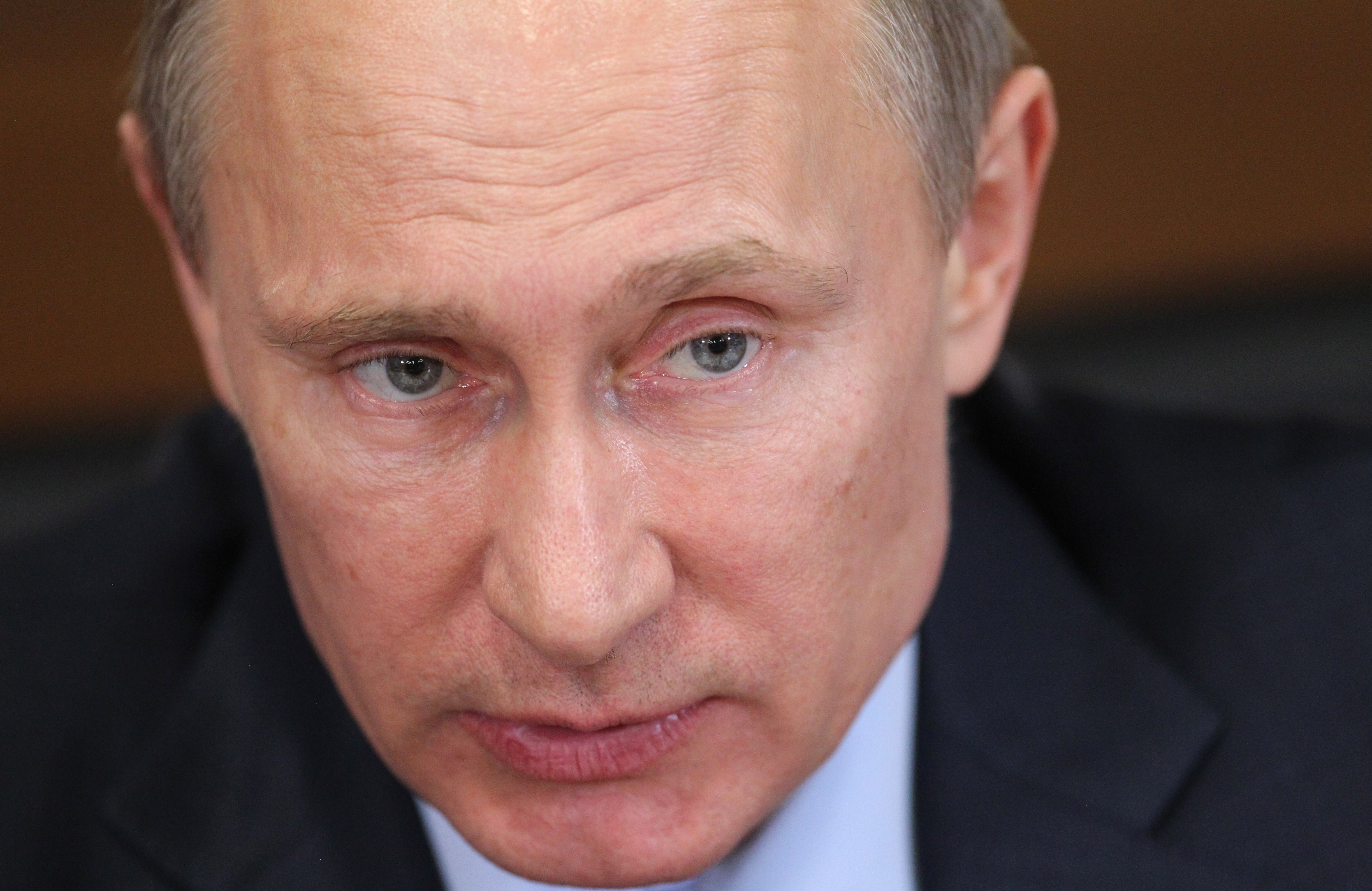 Russian President Vladimir Putin attends a meeting with ministers from the Federal Financial Monitoring Service (Rosfinmonitoring) to discuss the fight against money laundering on March 4, 2014 in Moscow, Russia.