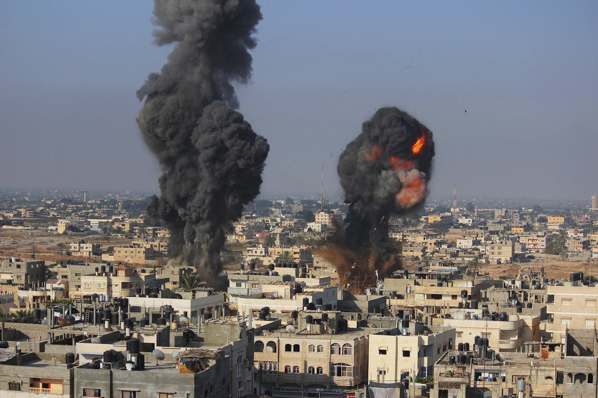 Smoke and flames are seen following what police said was an Israeli air strike in Rafah in the southern Gaza Strip July 9, 2014.