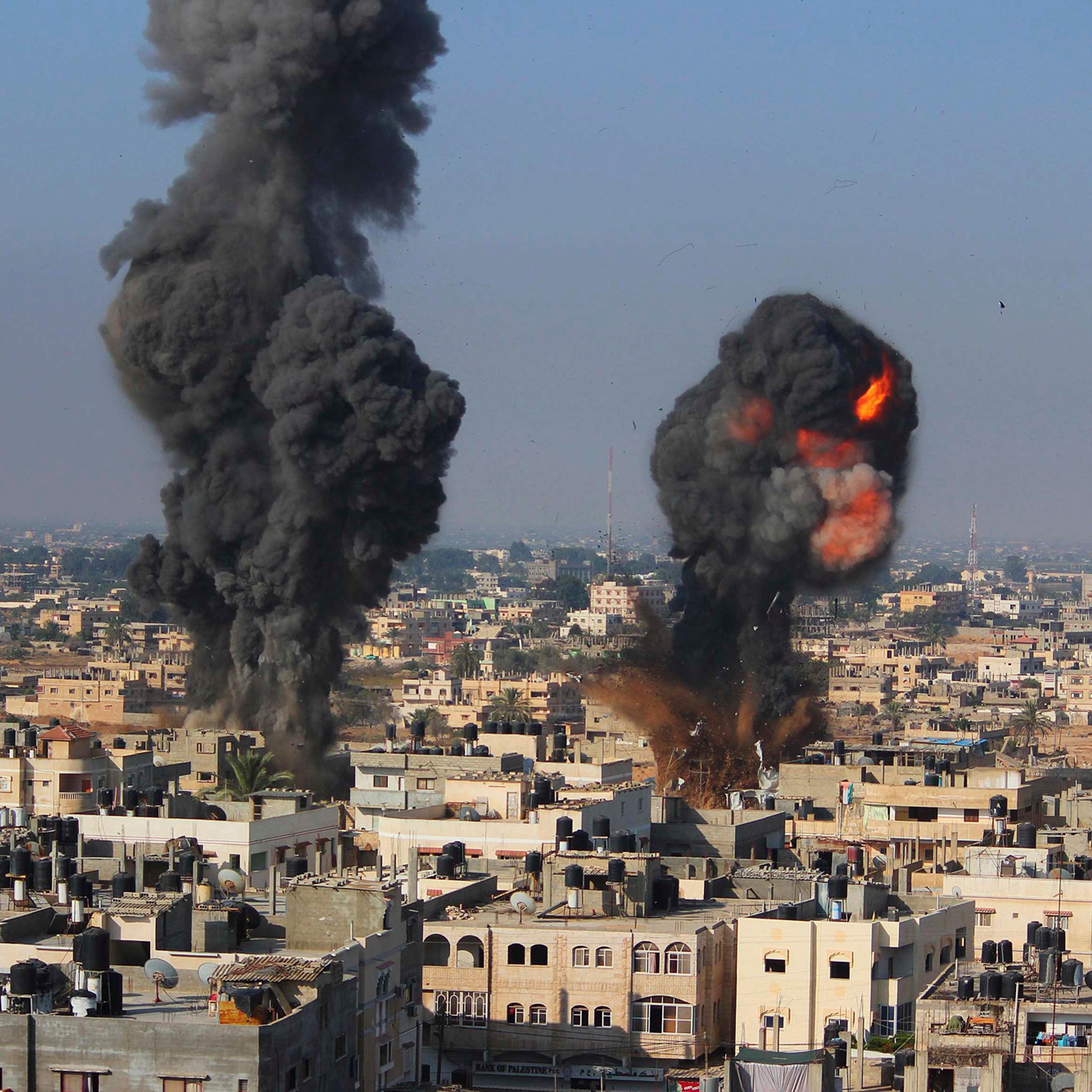 Smoke and flames are seen following what police said was an Israeli air strike in Rafah in the southern Gaza Strip July 9, 2014.