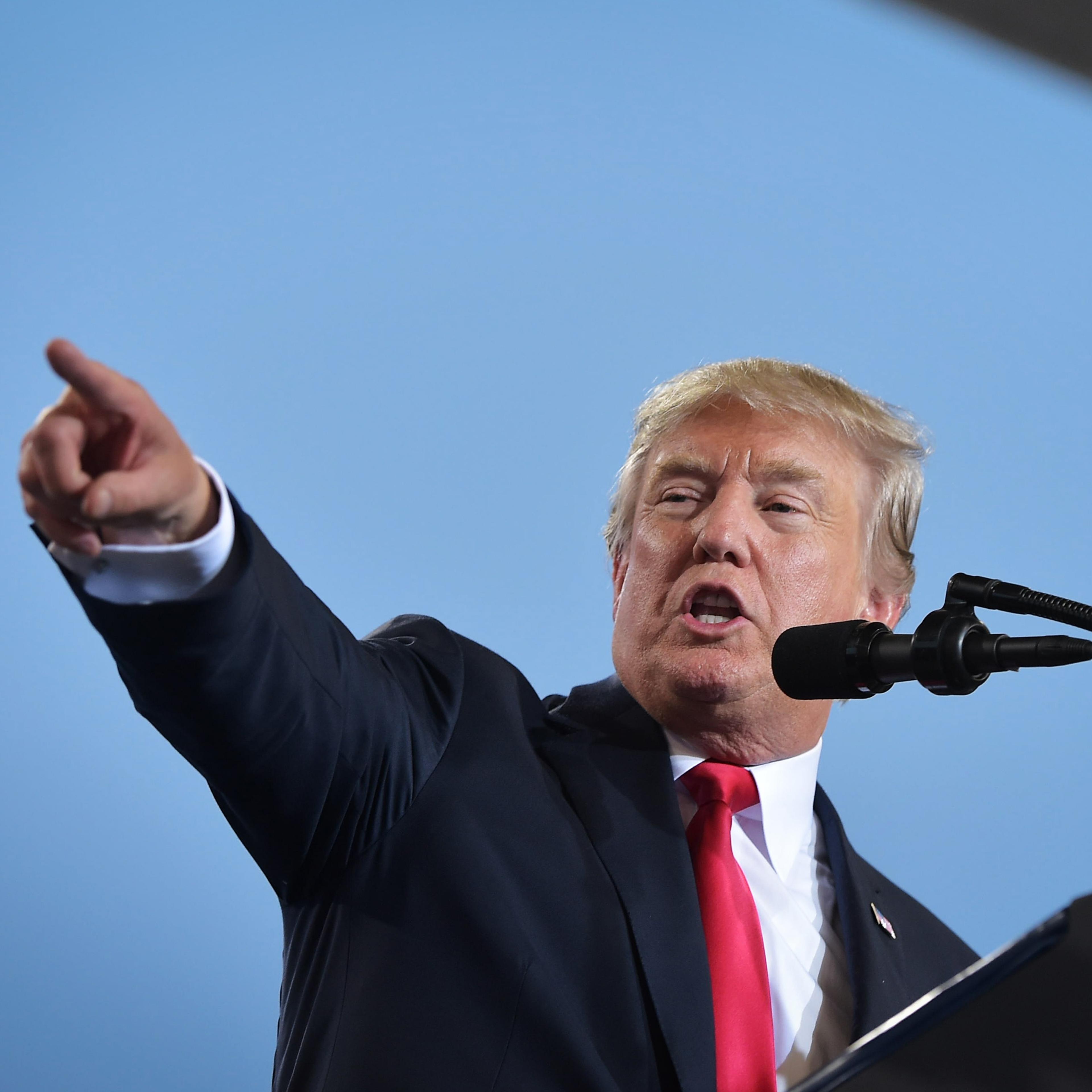 US President Donald Trump speaks on tax reform inside a hangar at the Harrisburg International Airport on October 11, 2017 in Middletown, Pennsylvania.