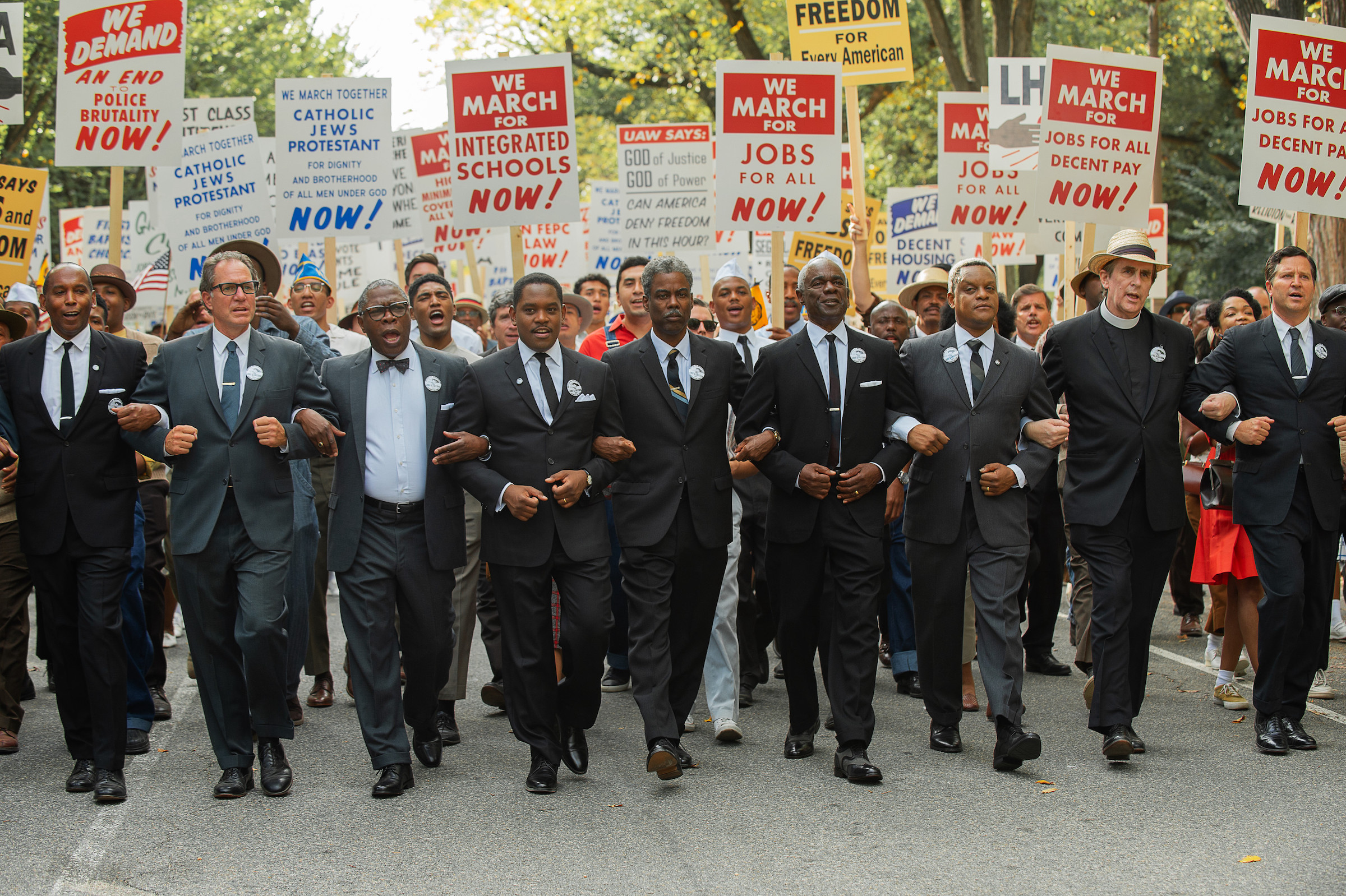 (L to R) Michael Potts as Cleve Robinson, Aml Ameen as Martin Luther King Jr., Chris Rock as Roy Wilkins, Glynn Turman as A. Philip Randolph, and Kevin Mambo as Whitney Young in 'Rustin.'