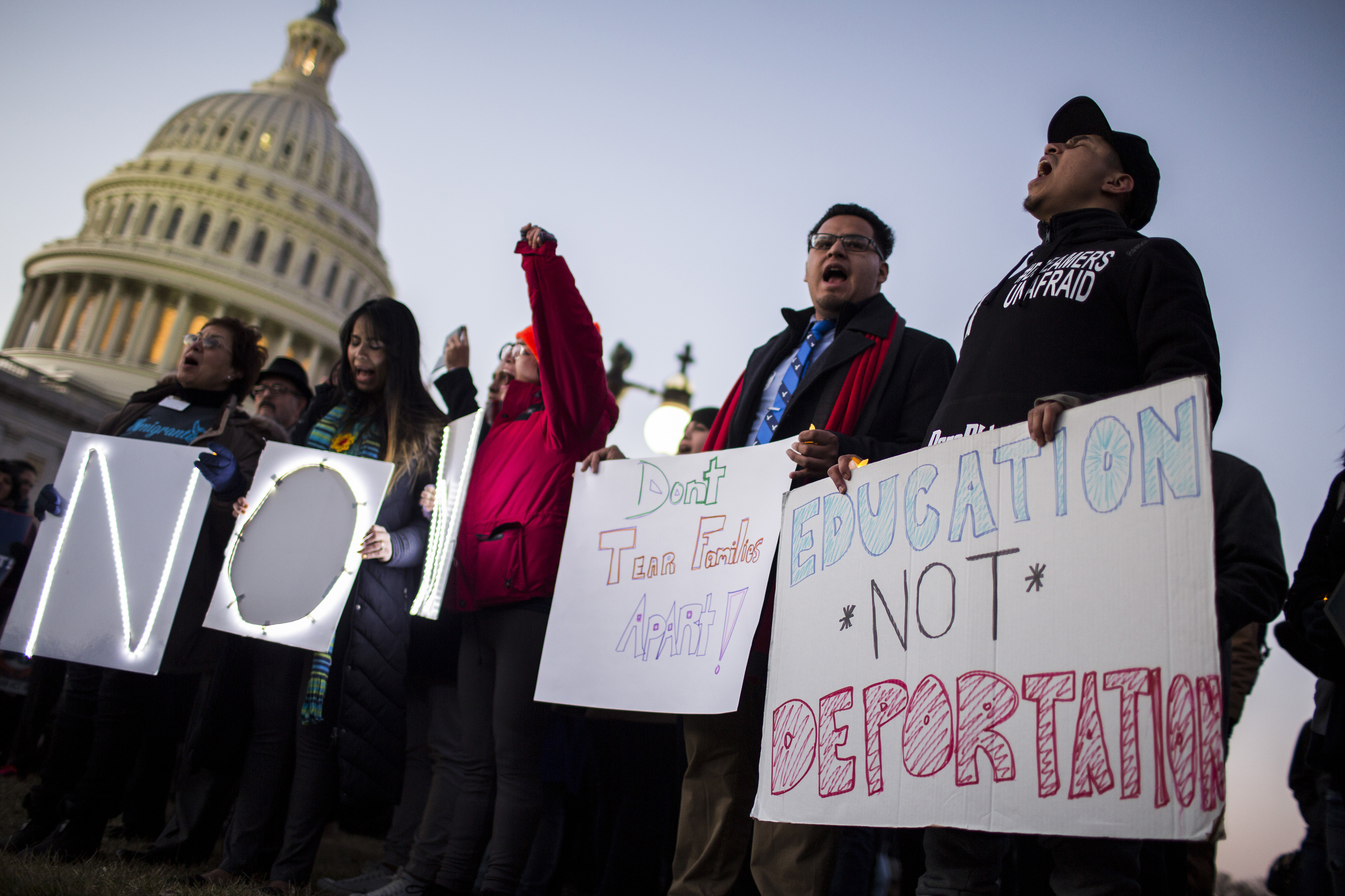 Demonstrators hold signs during a rally supporting the Deferred Action for Childhood Arrivals program (DACA), or the Dream Act, outside the U.S. Capitol building in Washington, D.C., U.S., on Thursday, Jan. 18, 2018.