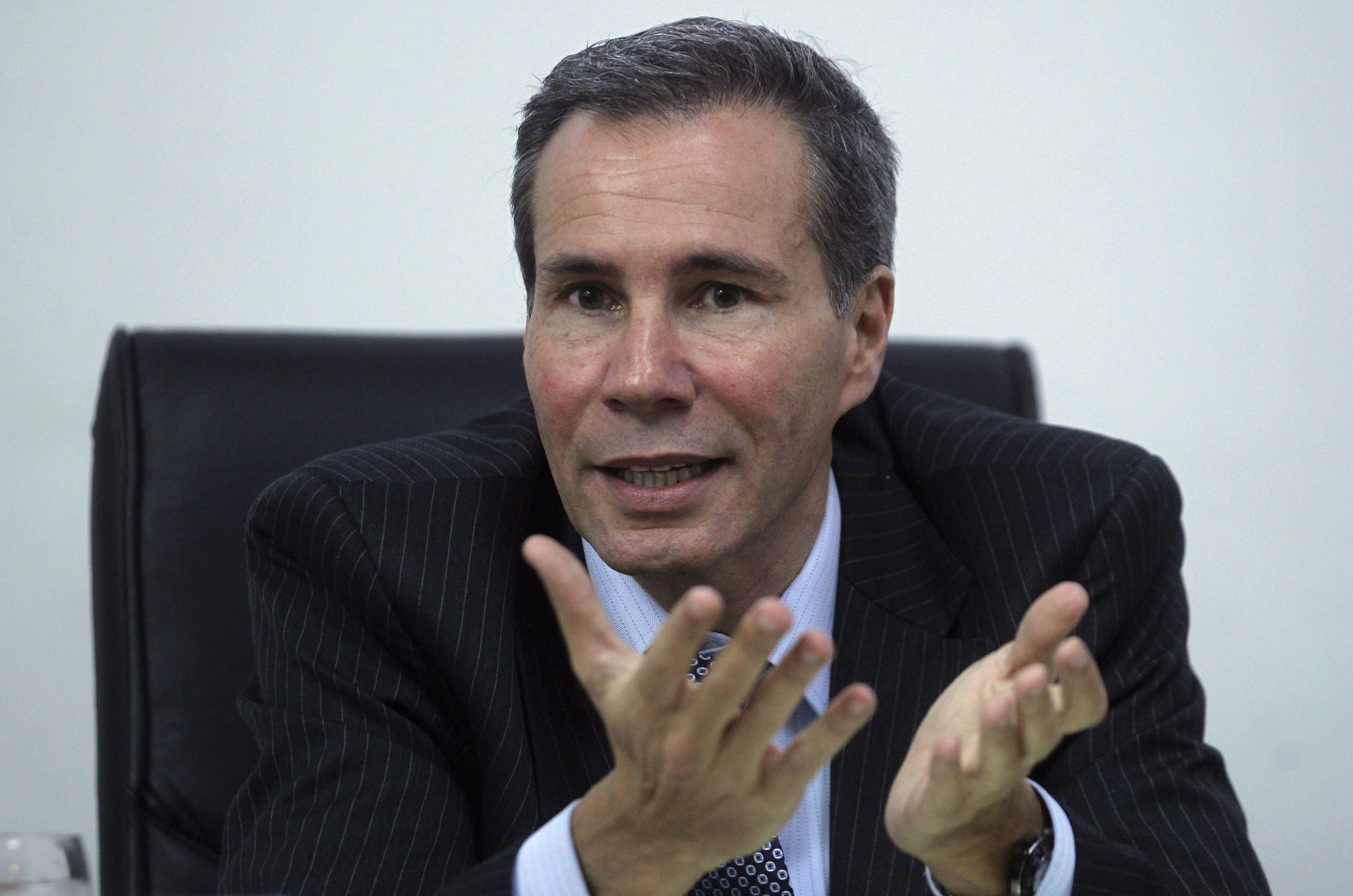 Argentine prosecutor Nisman, who is investigating the 1994 car-bomb attack on the AMIA Jewish community center, speaks during a meeting with journalists at his office in Buenos Aires