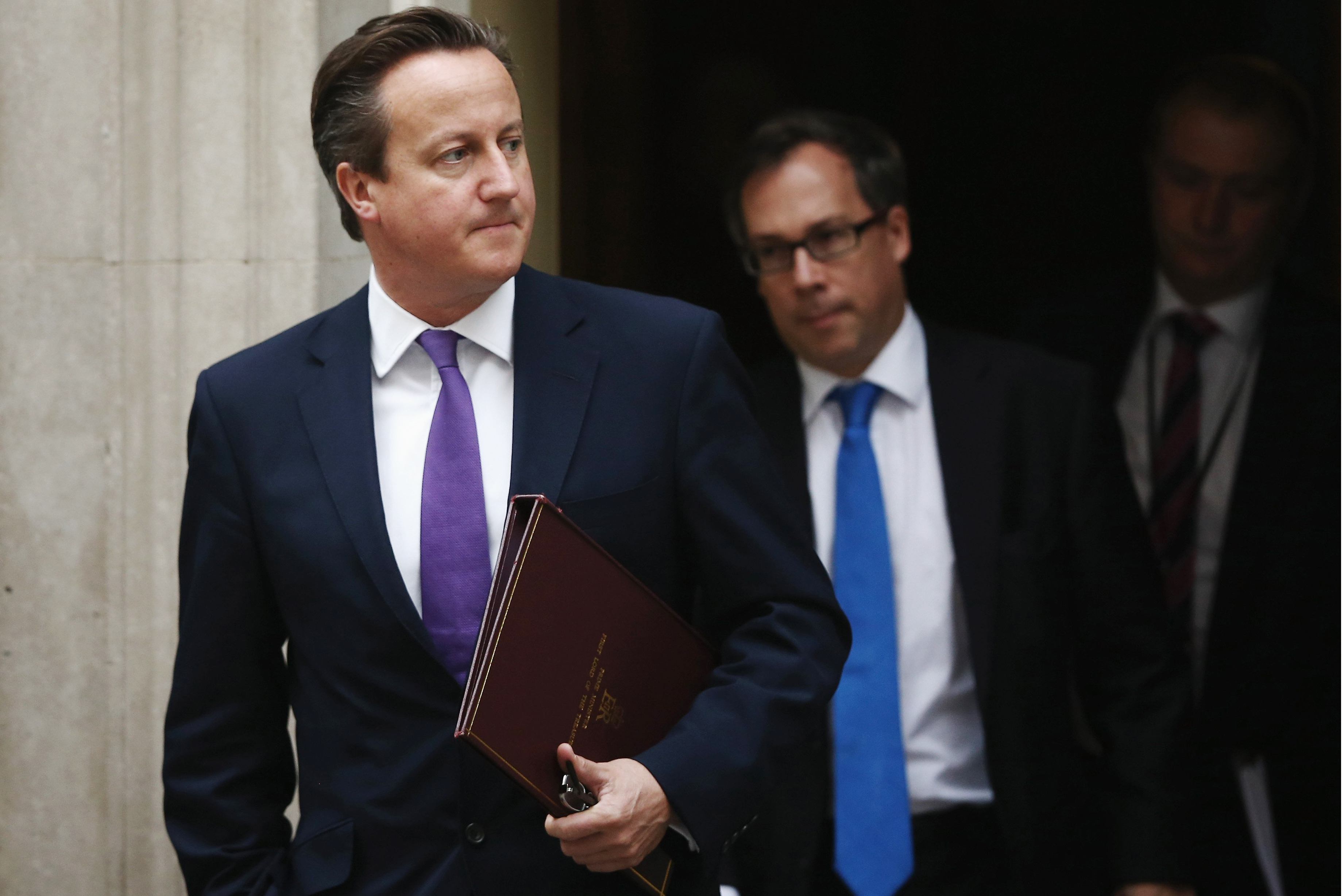 Prime Minister David Cameron leaves 10 Downing Street before heading to The Houses of Parliament on Sept. 26, 2014 in London.