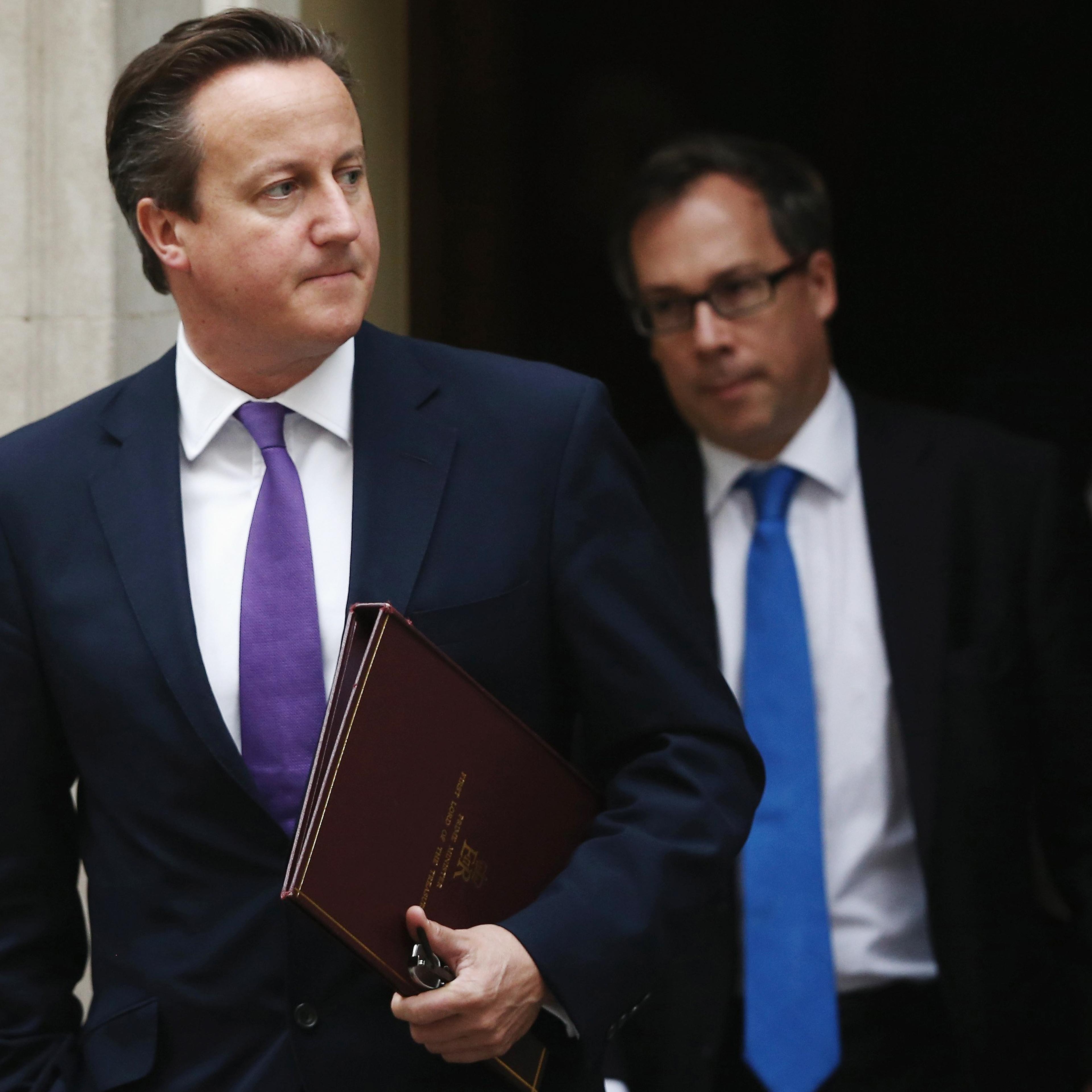 Prime Minister David Cameron leaves 10 Downing Street before heading to The Houses of Parliament on Sept. 26, 2014 in London.