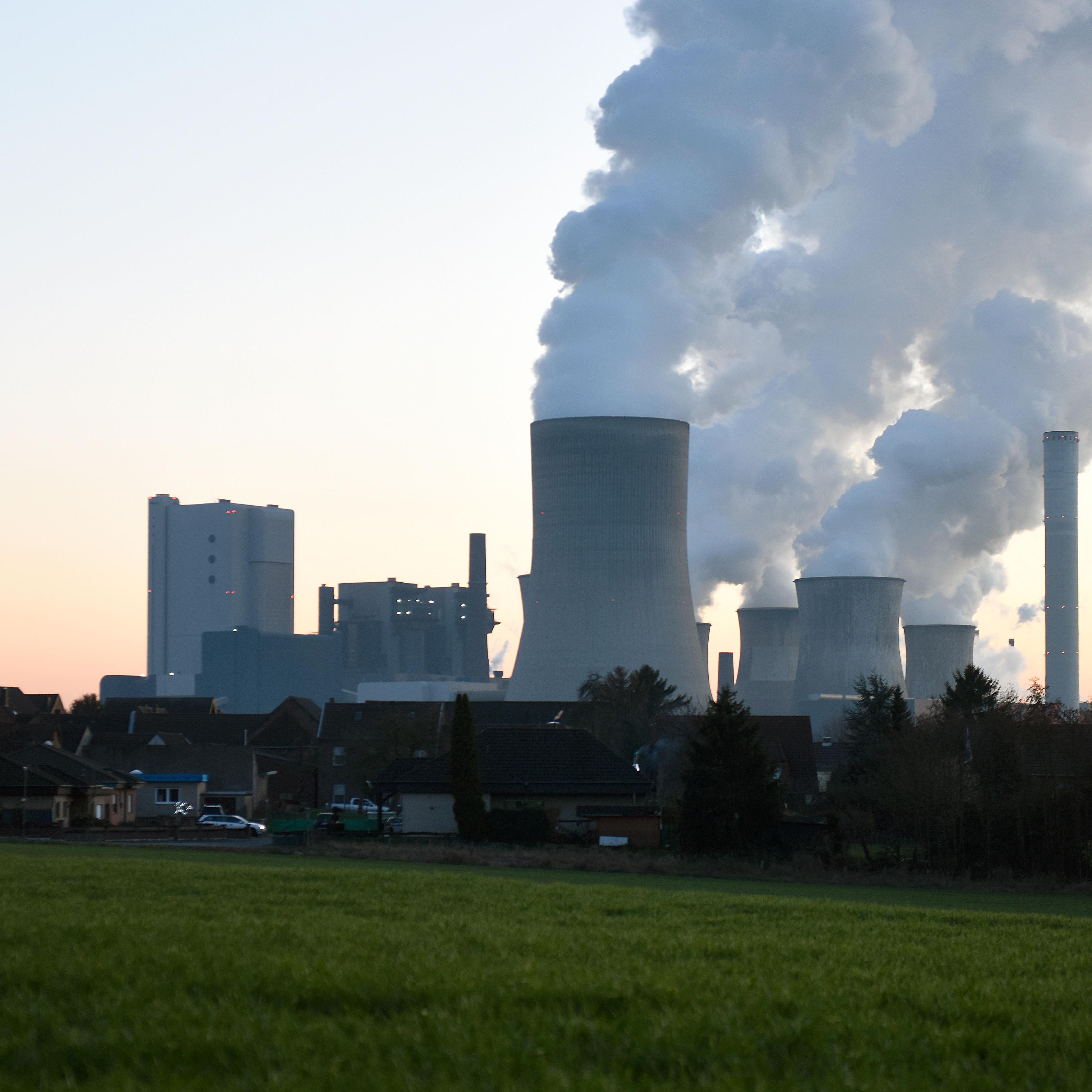 Steam rises from cooling towers at the RWE Niederaussem coal-fired power plant on February 16, 2016 near Bergheim, Germany.