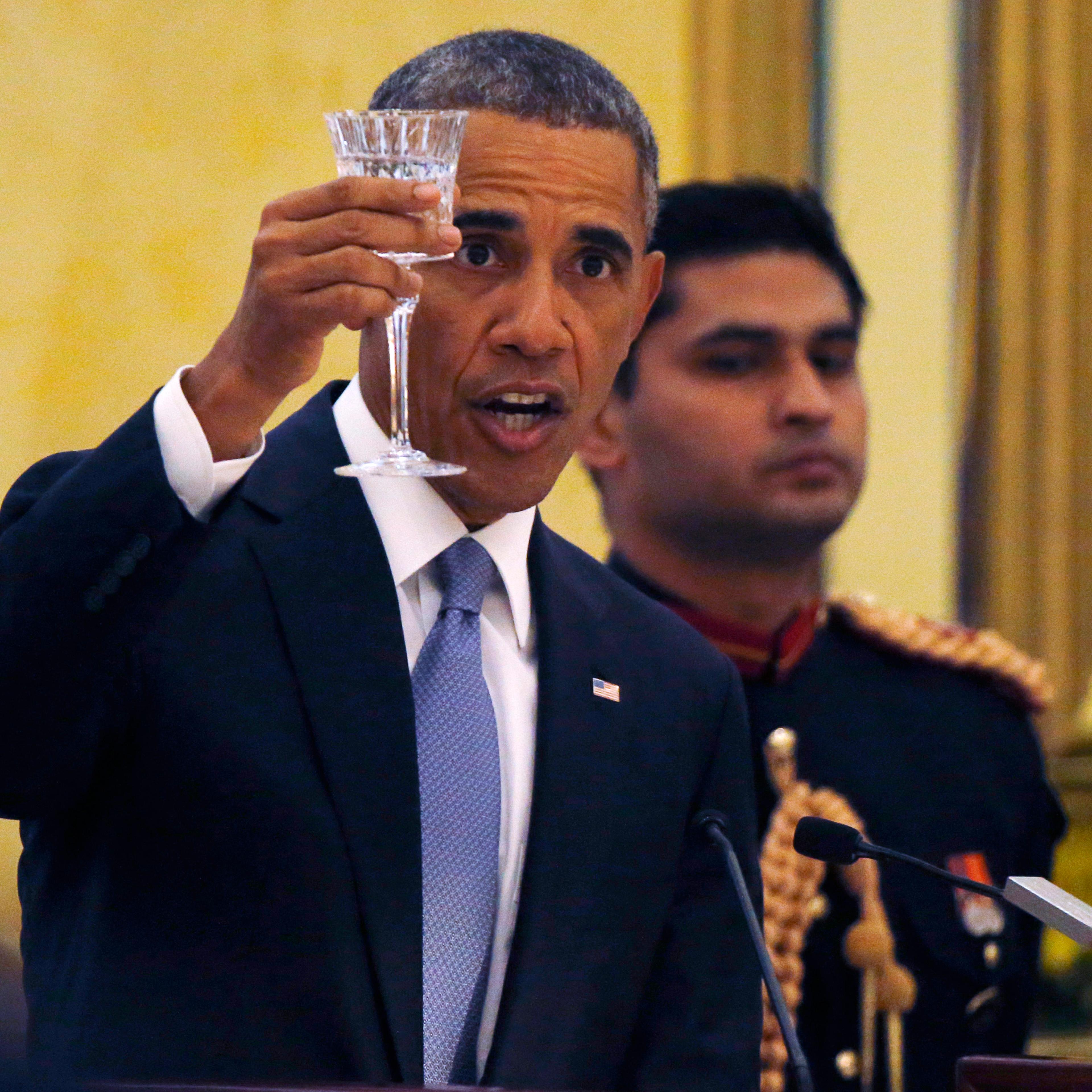 U.S. President Barack Obama delivers a toast as he attends an Official State Dinner at the Rashtrapati Bhavan presidential palace in New Delhi