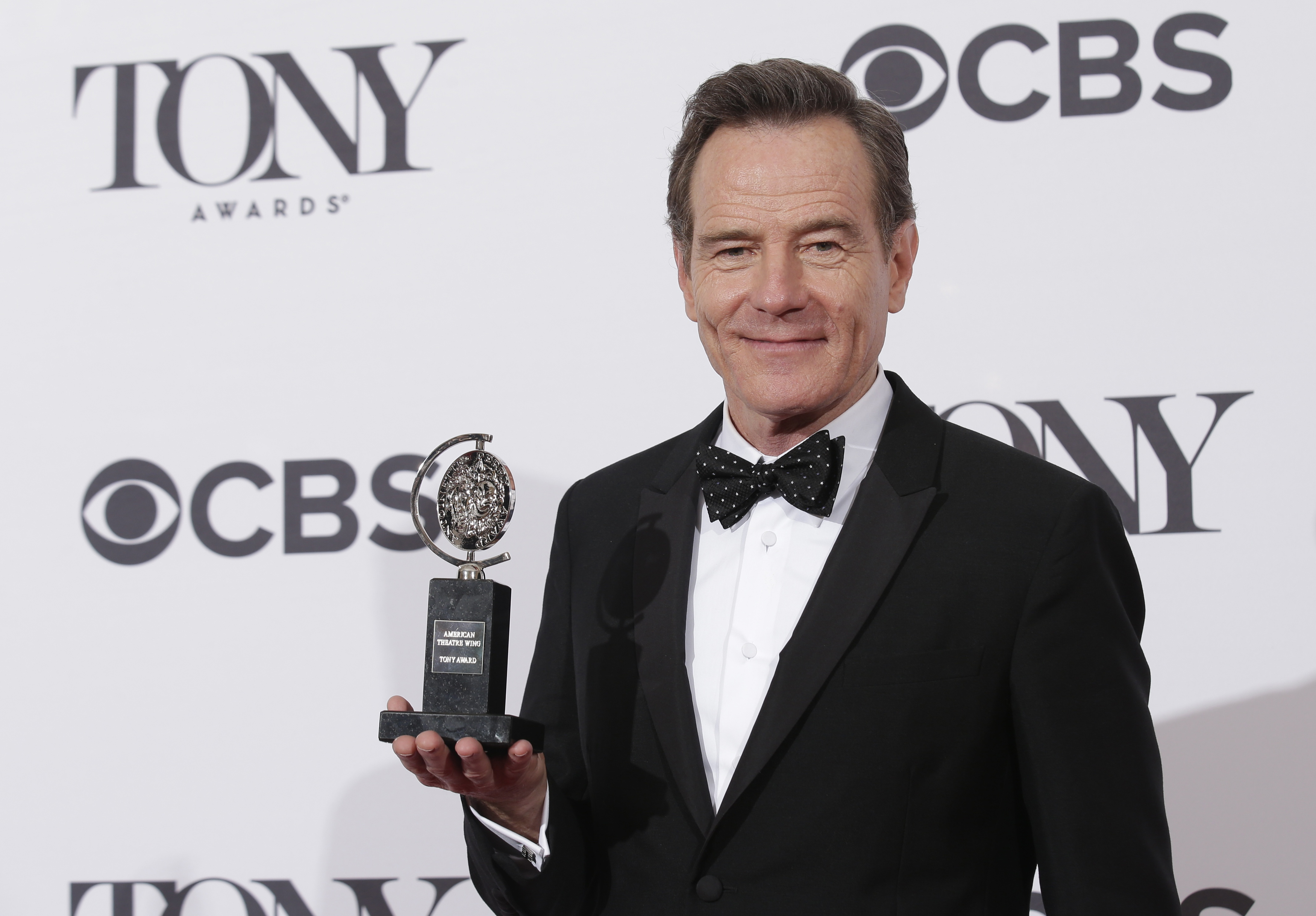 Actor Bryan Cranston poses backstage with his Tony Award at the American Theatre Wing's 68th annual Tony Awards at Radio City Music Hall in New York
