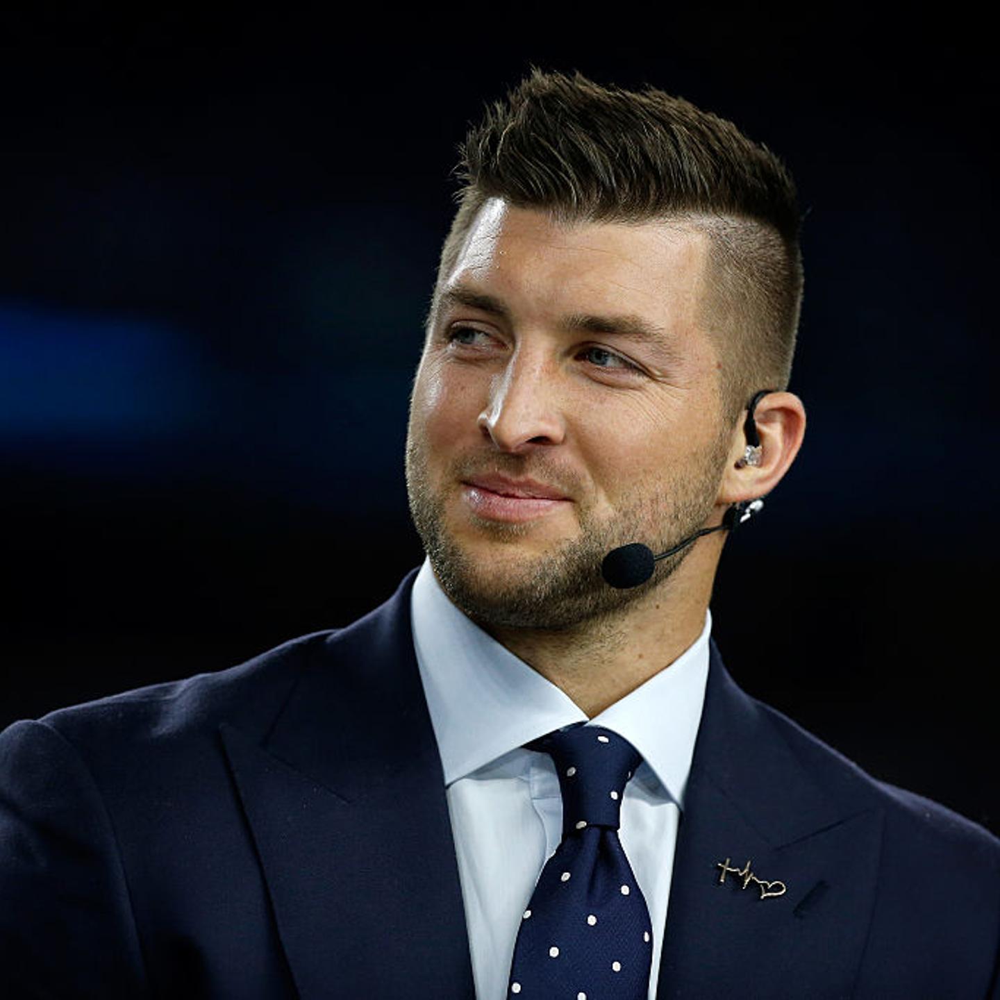 Broadcaster Tim Tebow of the SEC Network speaks on air on Dec. 31, 2015 in Arlington, Texas.