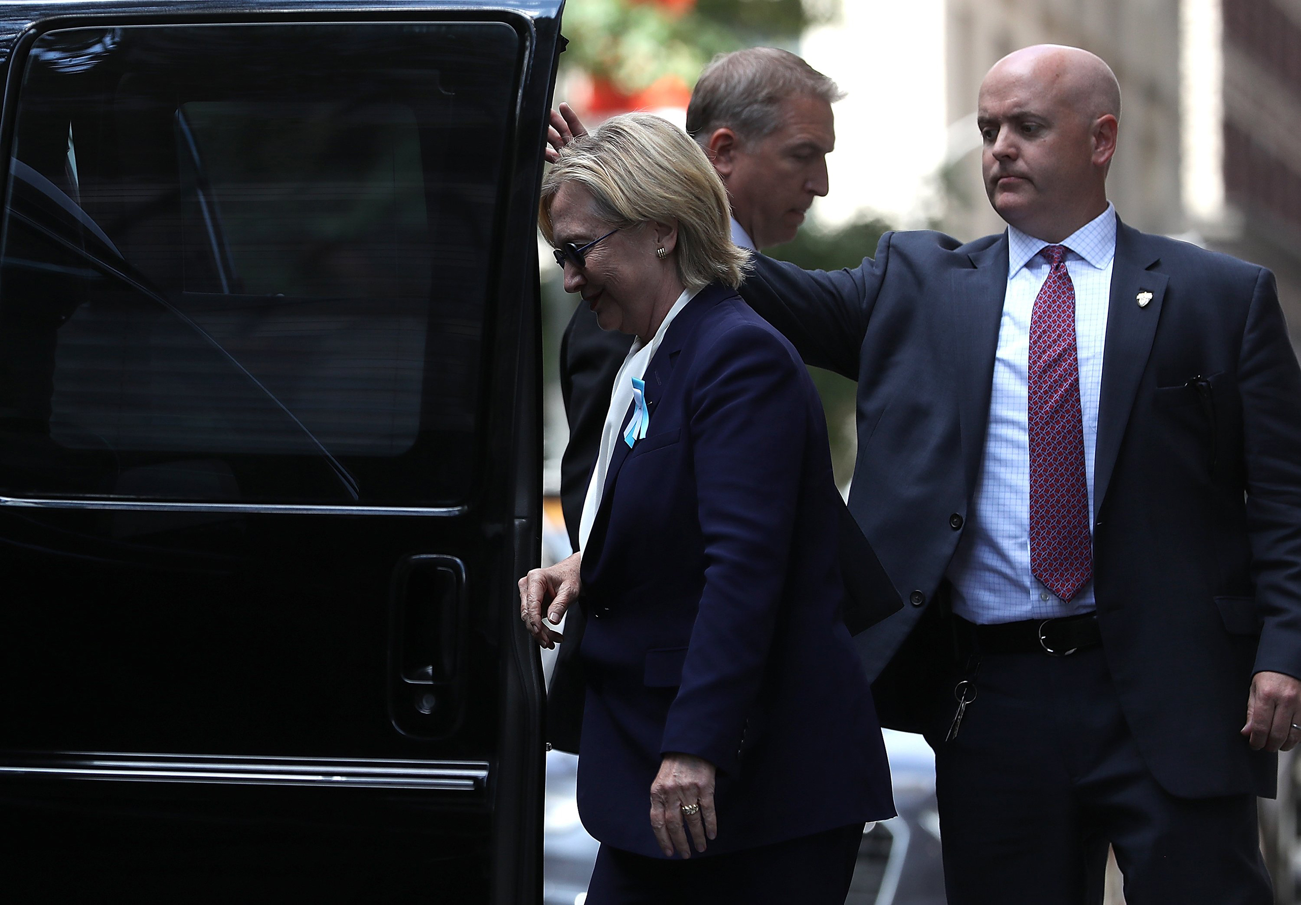 Hillary Clinton gets into a van as she leaves the home of her daughter Chelsea Clinton in New York City on Sept. 11, 2016.