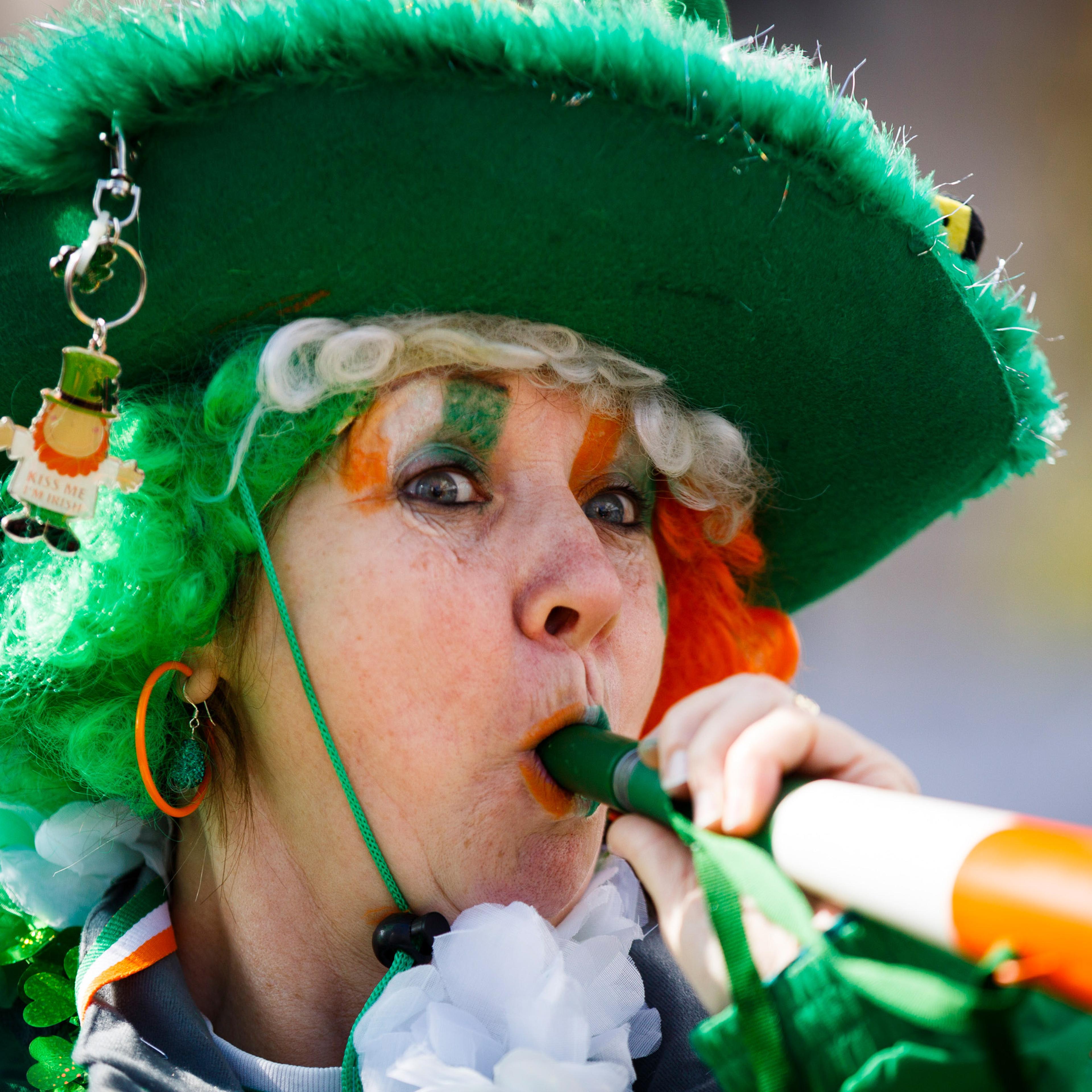 A woman takes part in the St Patrick's Day parade through central London, March 13, 2016.