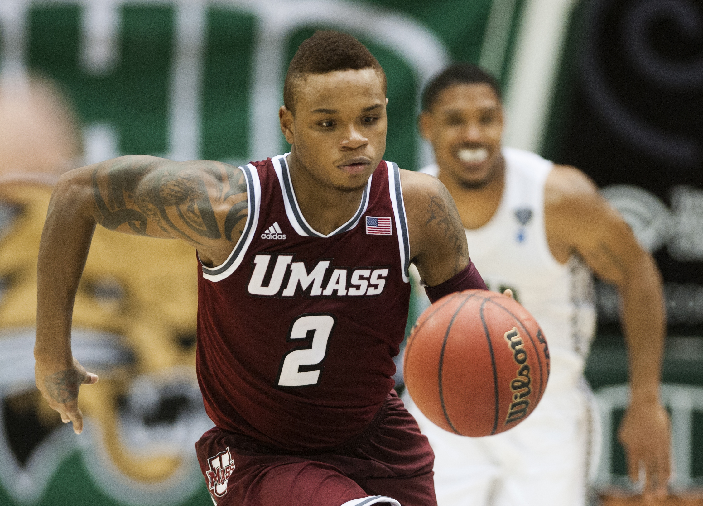 Massachusetts guard Derrick Gordon playing against Ohio in the second half of an NCAA college basketball game in Athens, Ohio on Dec. 18, 2013.