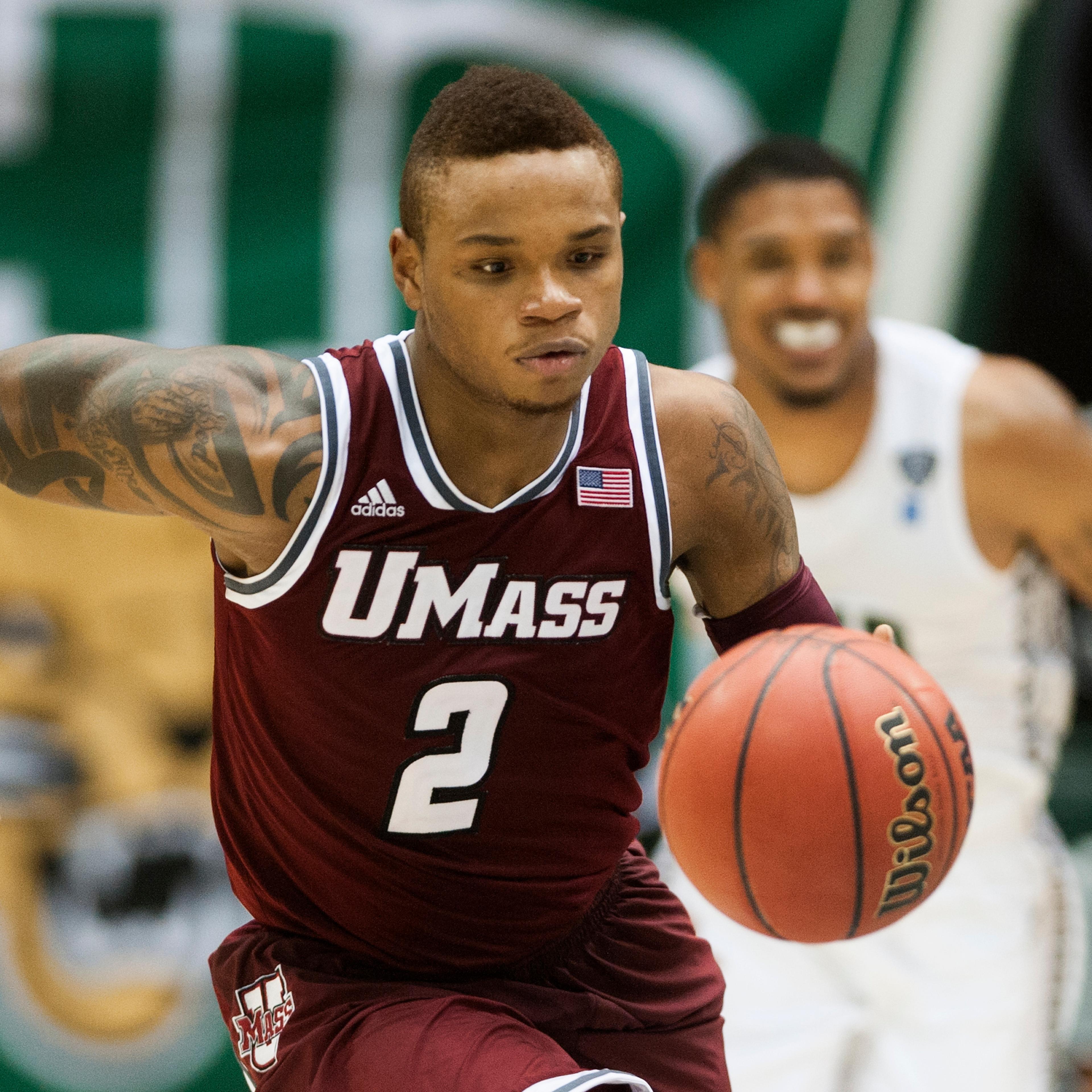 Massachusetts guard Derrick Gordon playing against Ohio in the second half of an NCAA college basketball game in Athens, Ohio on Dec. 18, 2013.
