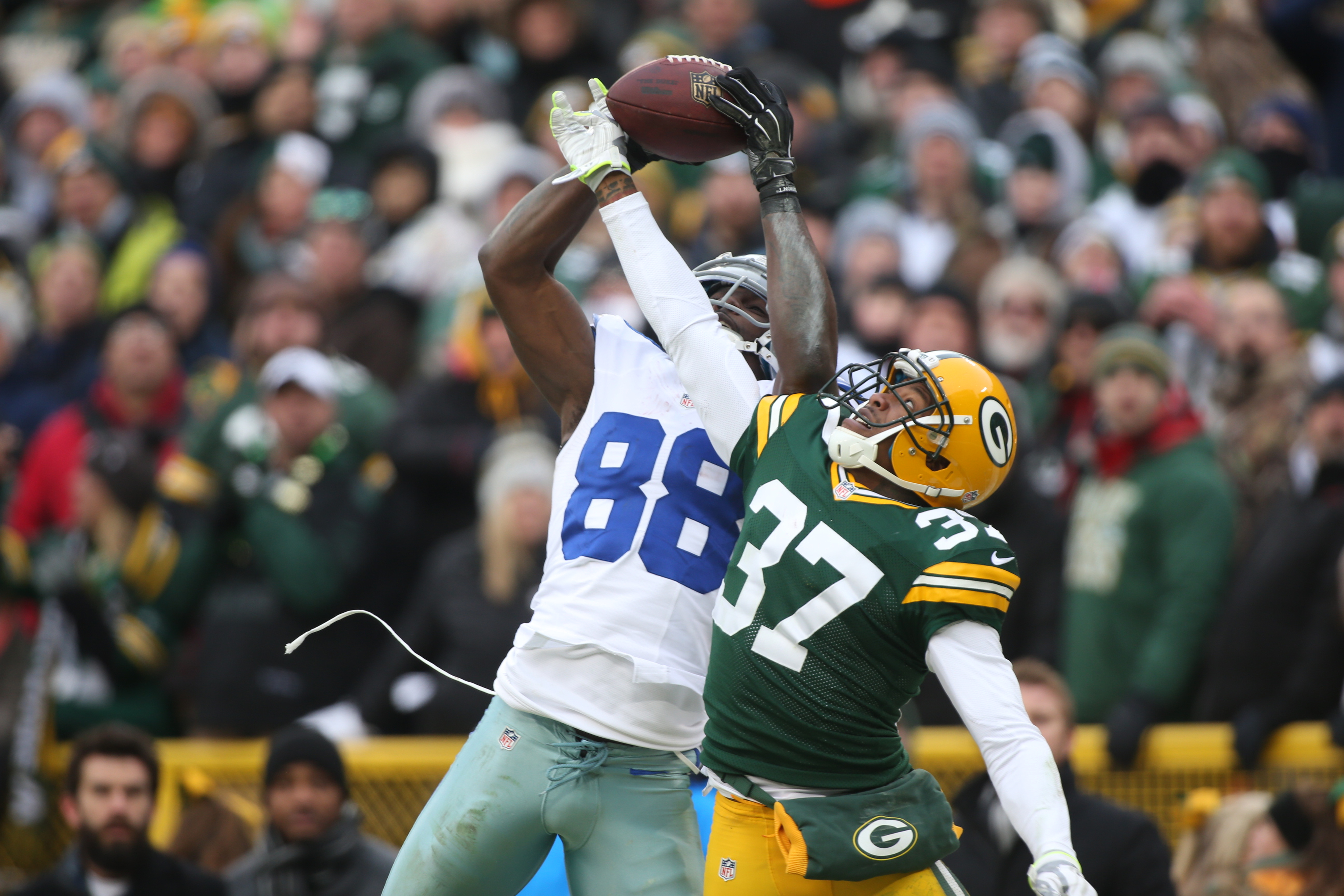 Dallas Cowboys wide receiver Dez Bryant (88) makes a catch and dives for the end zone as Green Bay Packers cornerback Sam Shields (37) defends during a game in Green Bay, Wis. on Jan. 11, 2015.