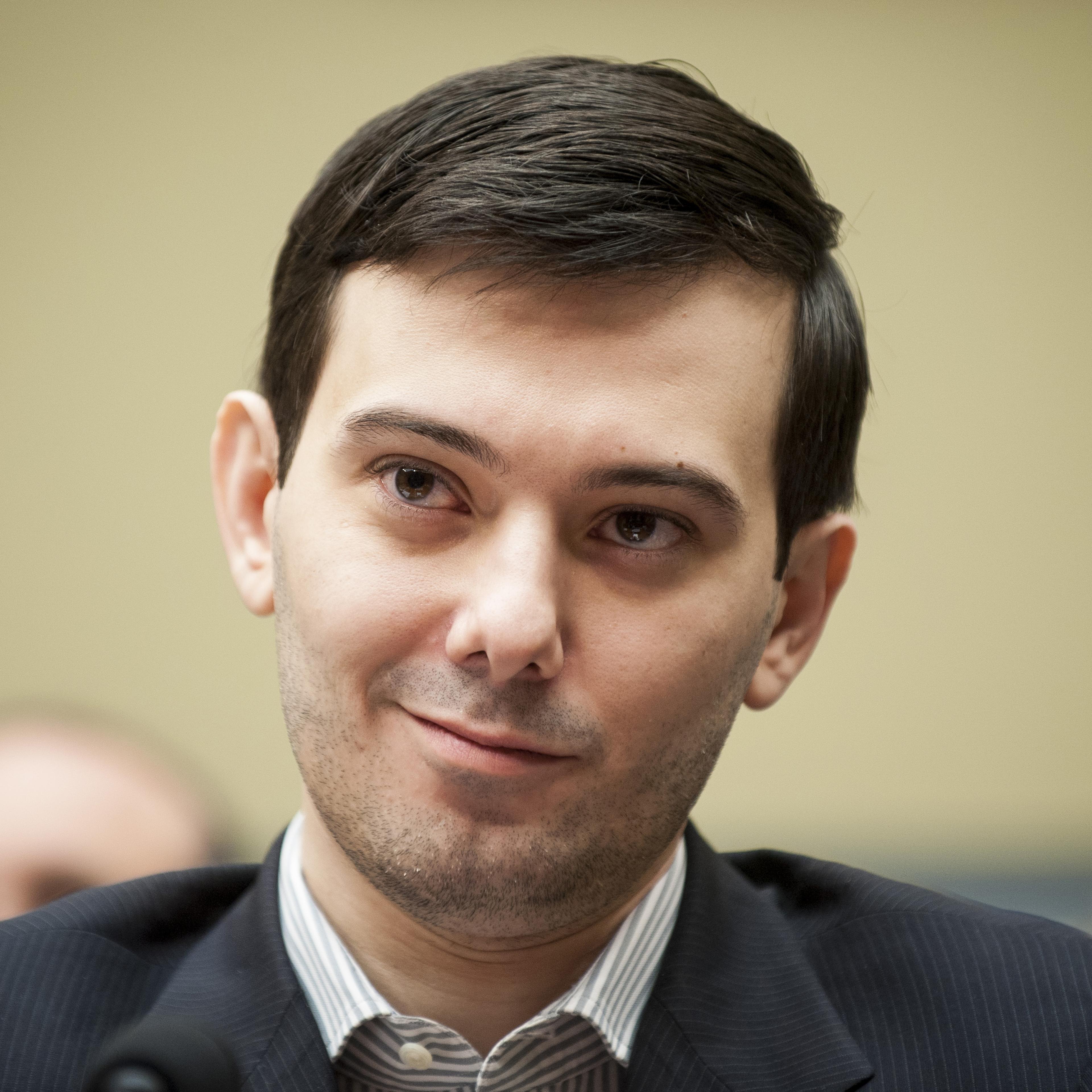 Martin Shkreli, former chief executive officer of Turing Pharmaceuticals LLC, smiles during a House Committee on Oversight and Government Reform hearing on prescription drug prices in Washington, D.C., U.S., on Thursday, Feb. 4, 2016.