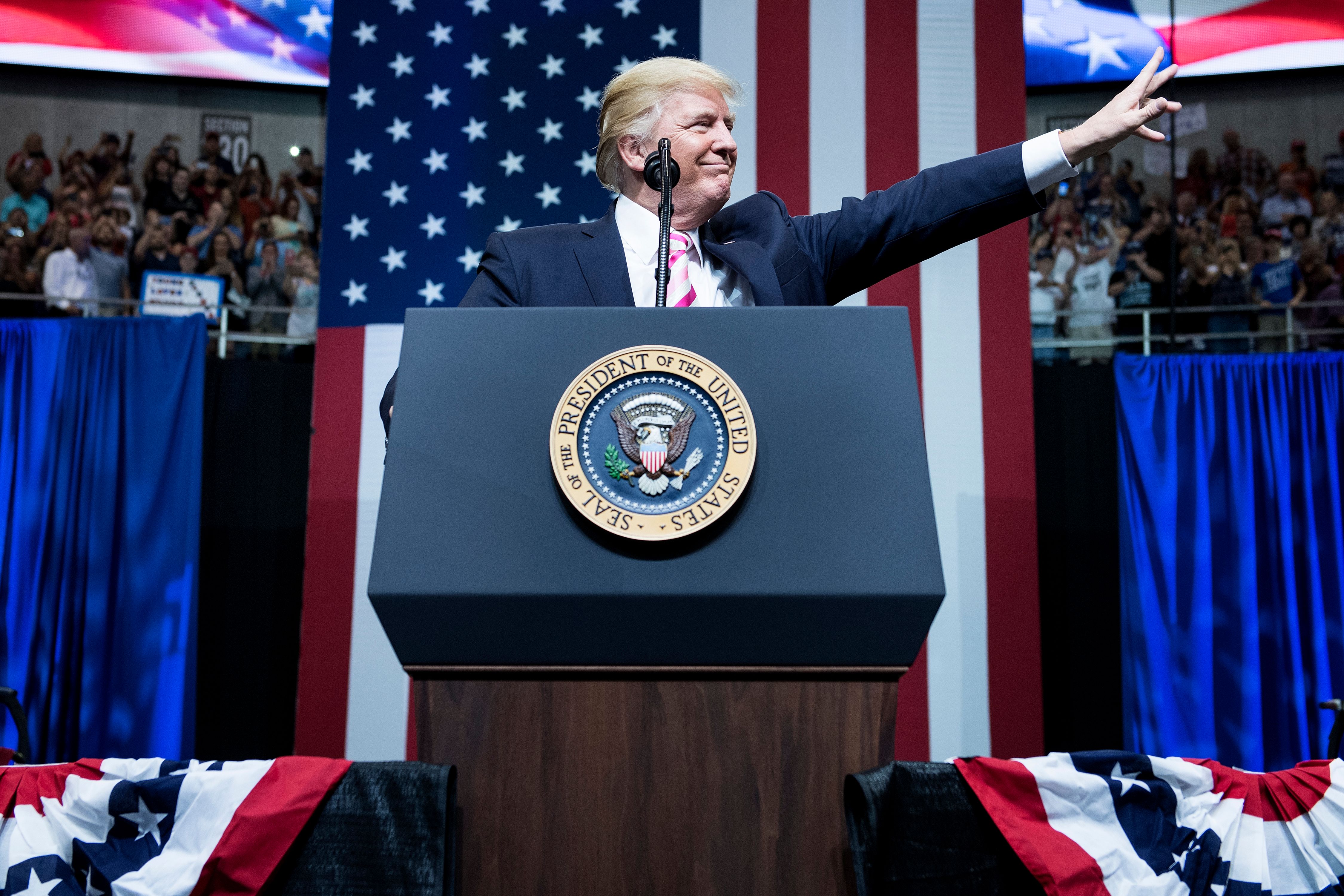 President Donald Trump waves during rally