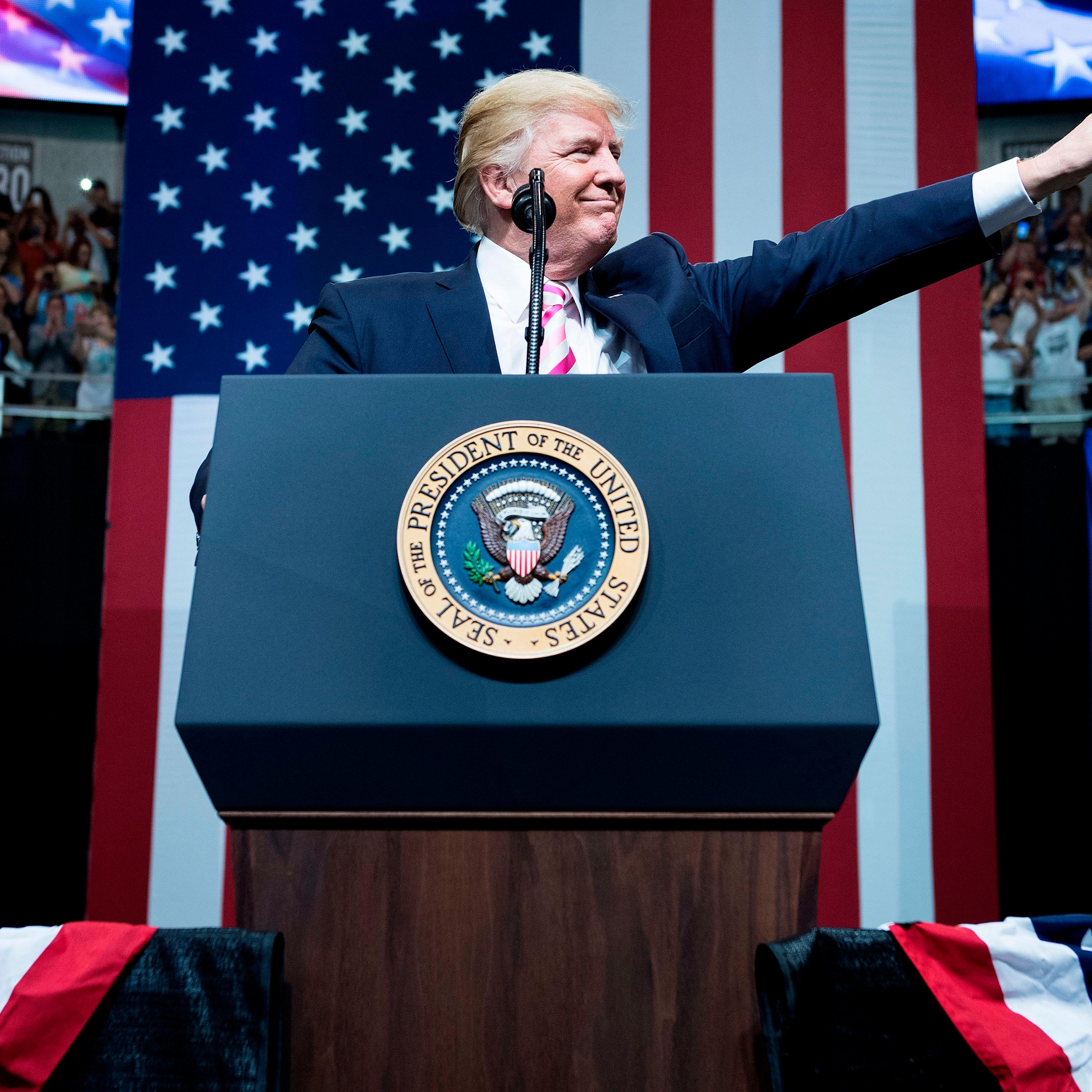 President Donald Trump waves during rally