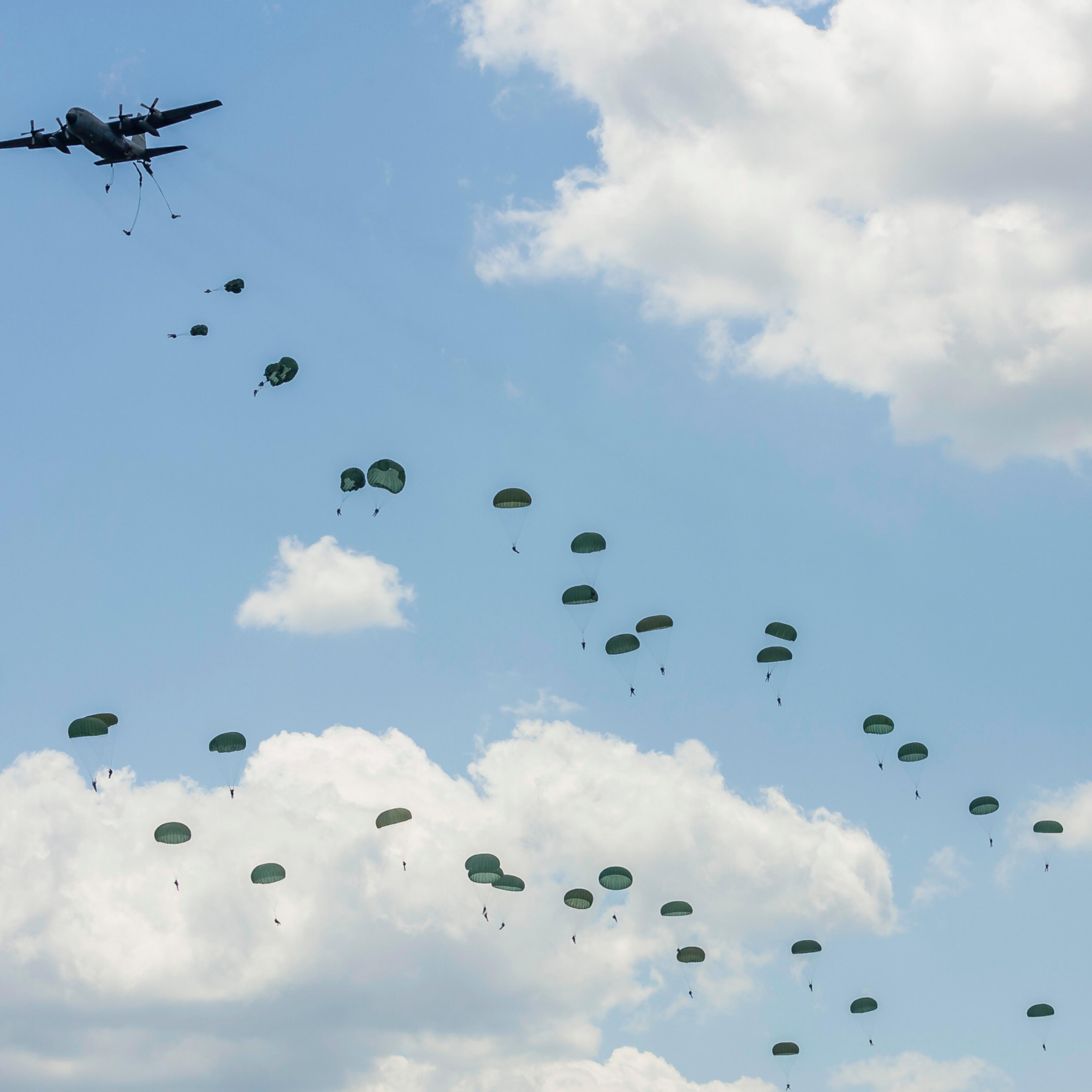 At least 22 soldiers were injured in a night time military exercise at a Mississippi military base after parachuting from a C-130 plane. Pictured are airborne troops over Andrews Air Force Base, Maryland after parachuting from a U.S. Air Force C-130 Herc