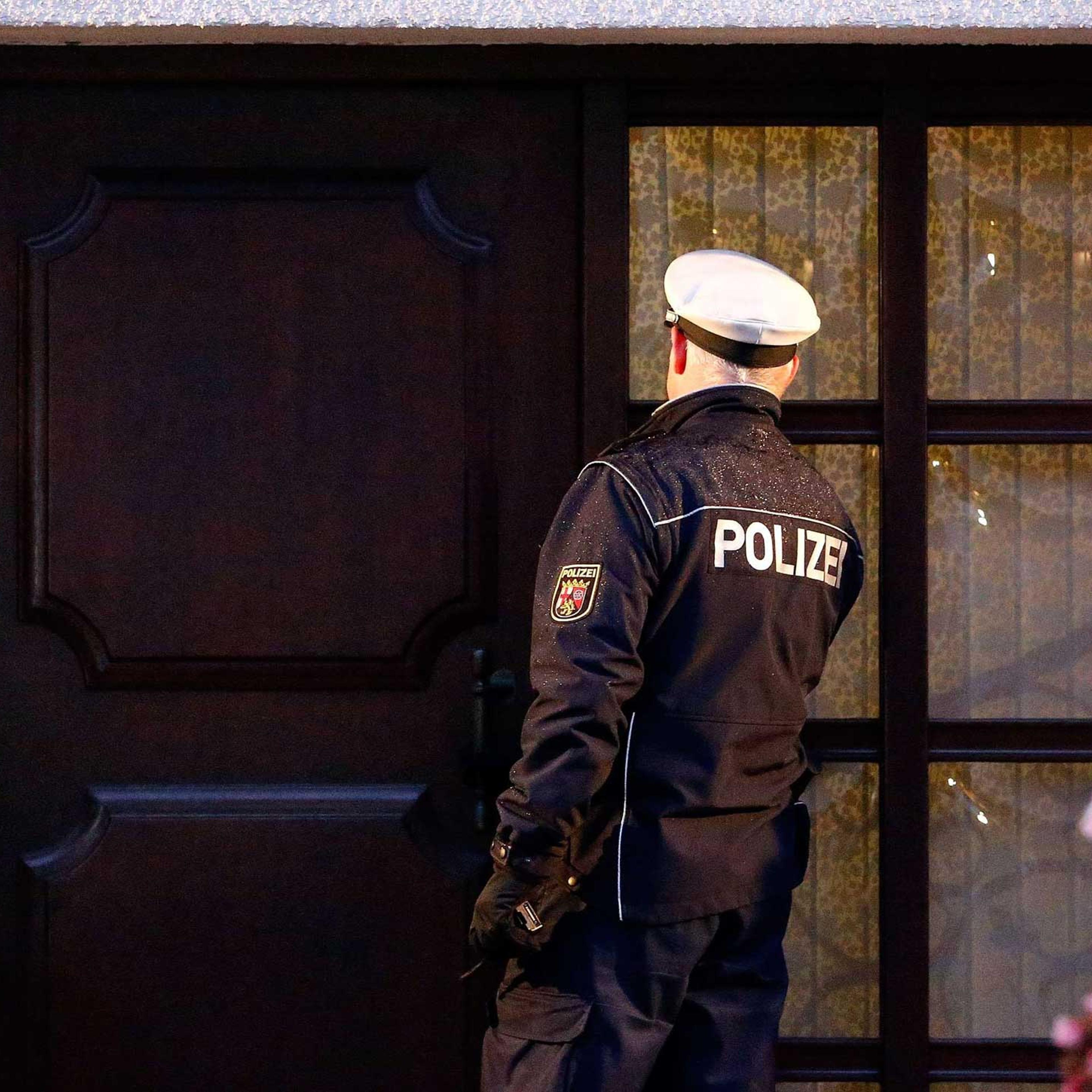 A German police officer enters the house believed to belong to crashed Germanwings flight 4U 9524 co-pilot Andreas Lubitz in Montabaur, Germany on March 26, 2015.
