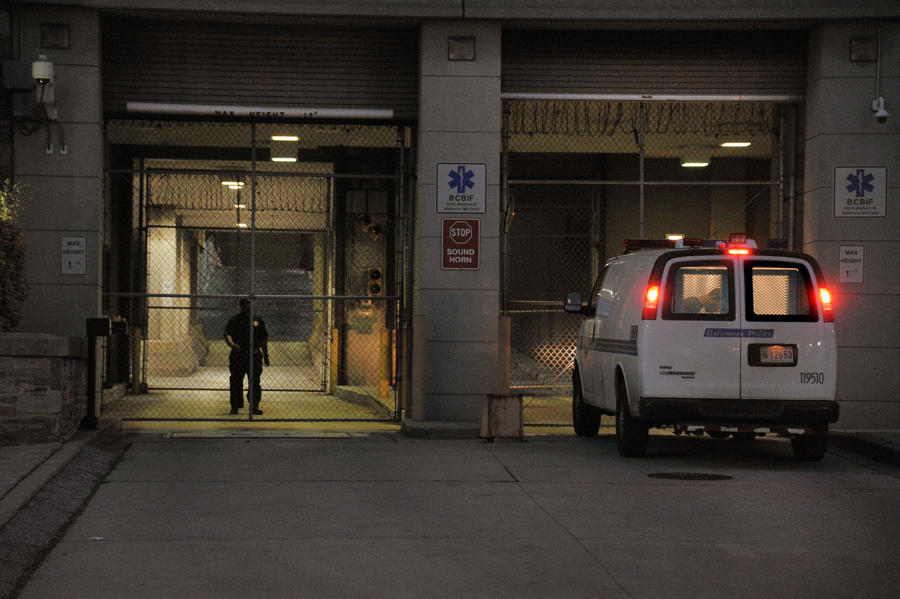 A Baltimore Police transfer van pulls into the Baltimore Central Booking and Intake Center on May 7, 2015.