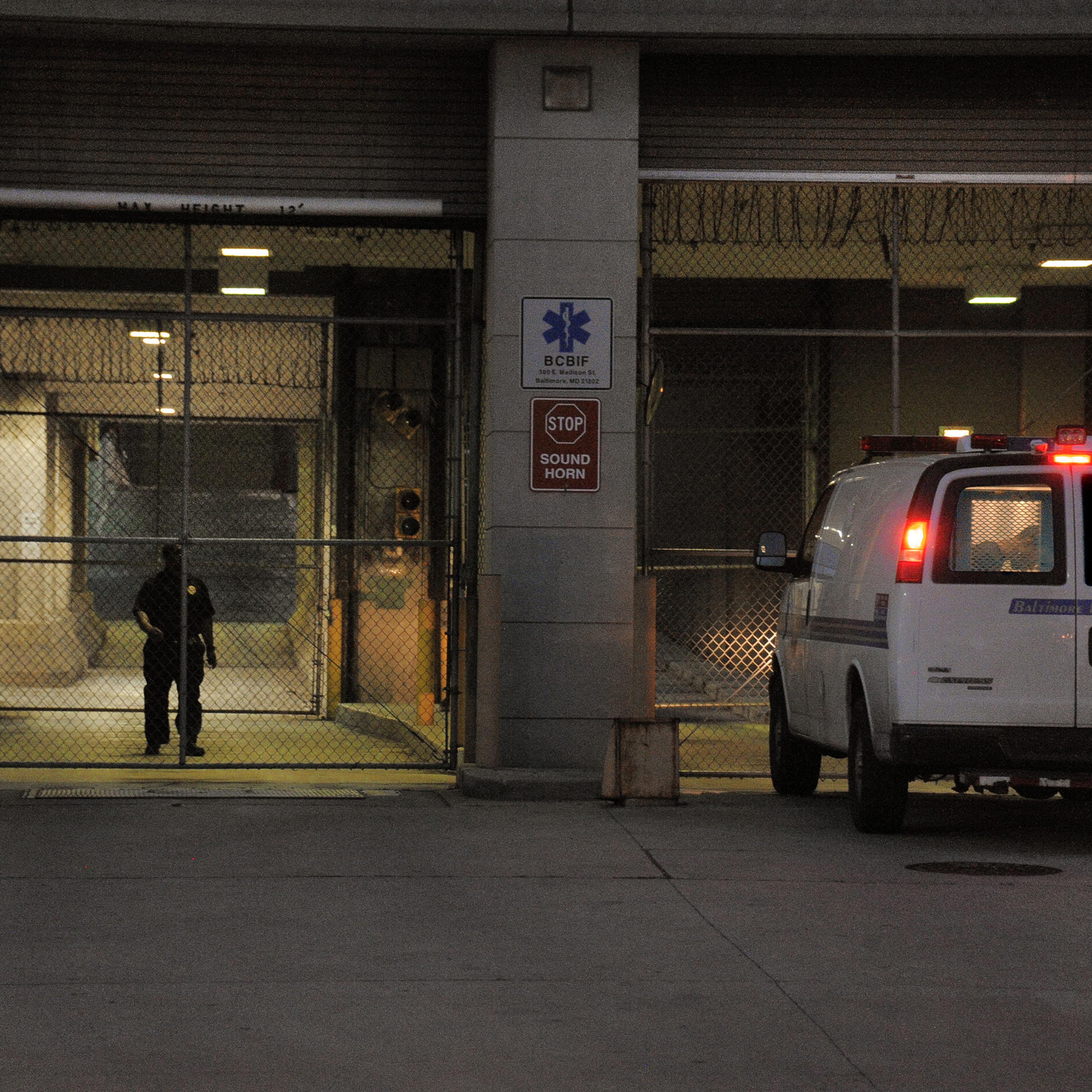 A Baltimore Police transfer van pulls into the Baltimore Central Booking and Intake Center on May 7, 2015.