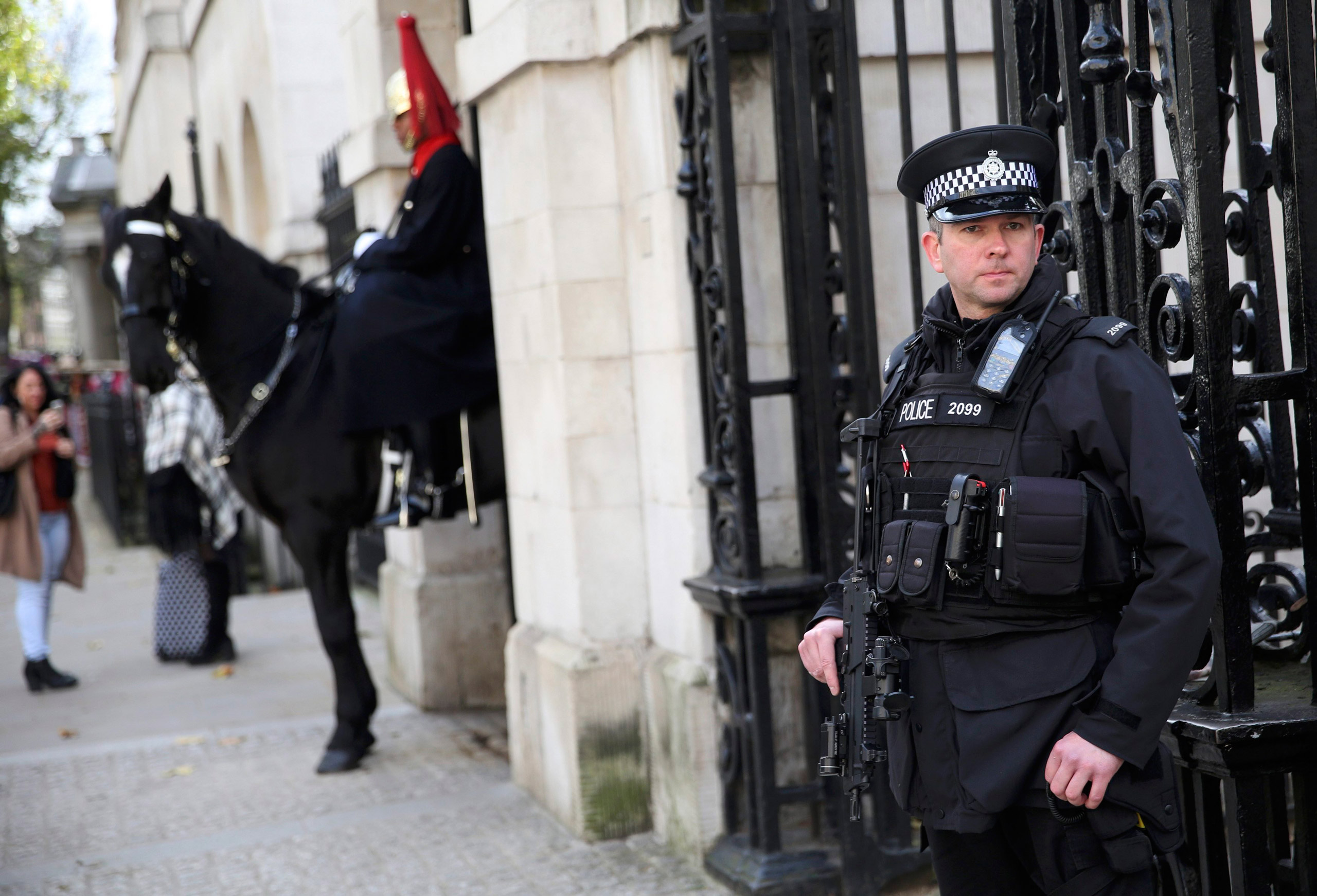An armed police officer stands outside Horseguards on Whitehall in London, Britain November 18, 2015. REUTERS/Neil Hall