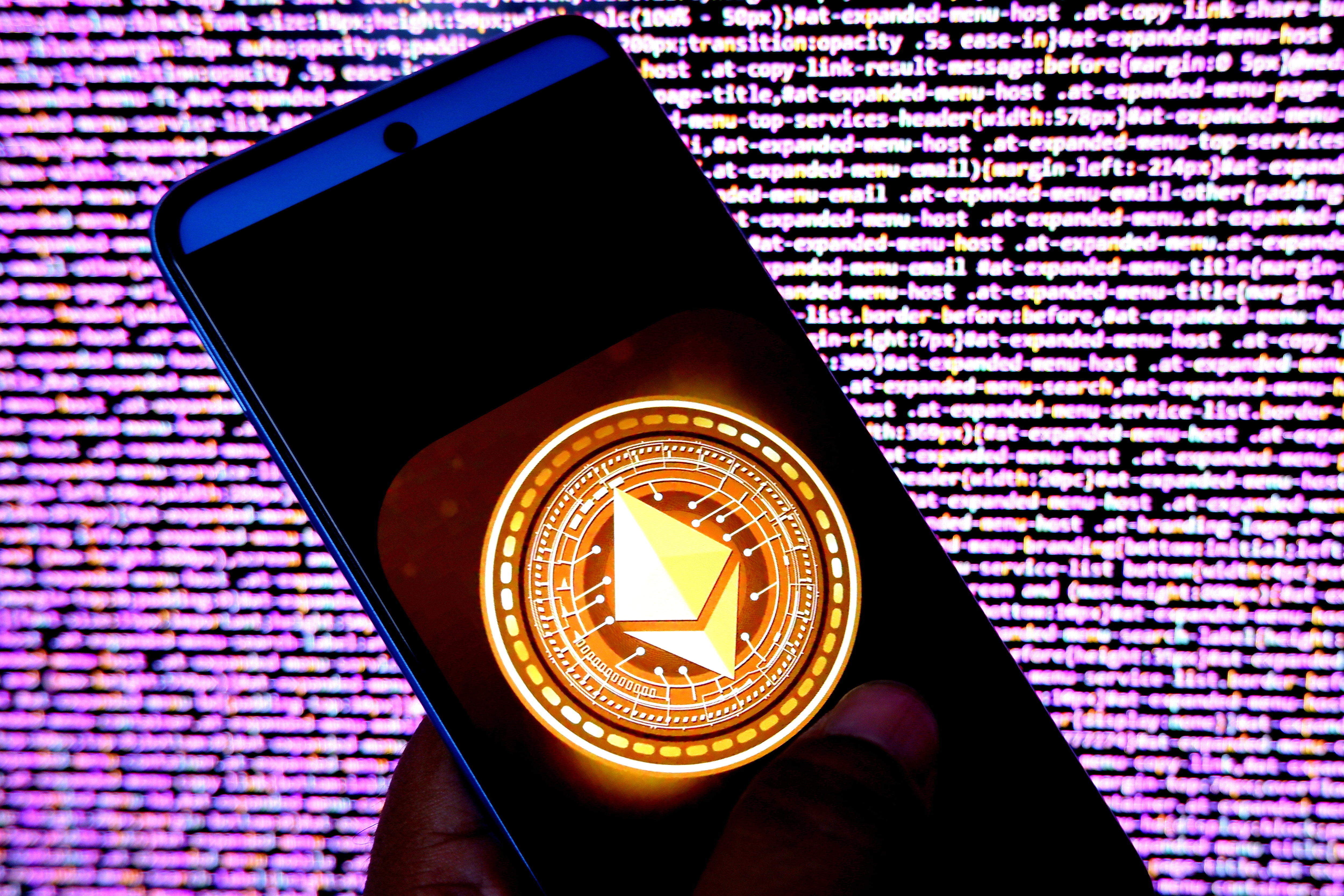 In this photo illustration, an Ethereum logo seen displayed