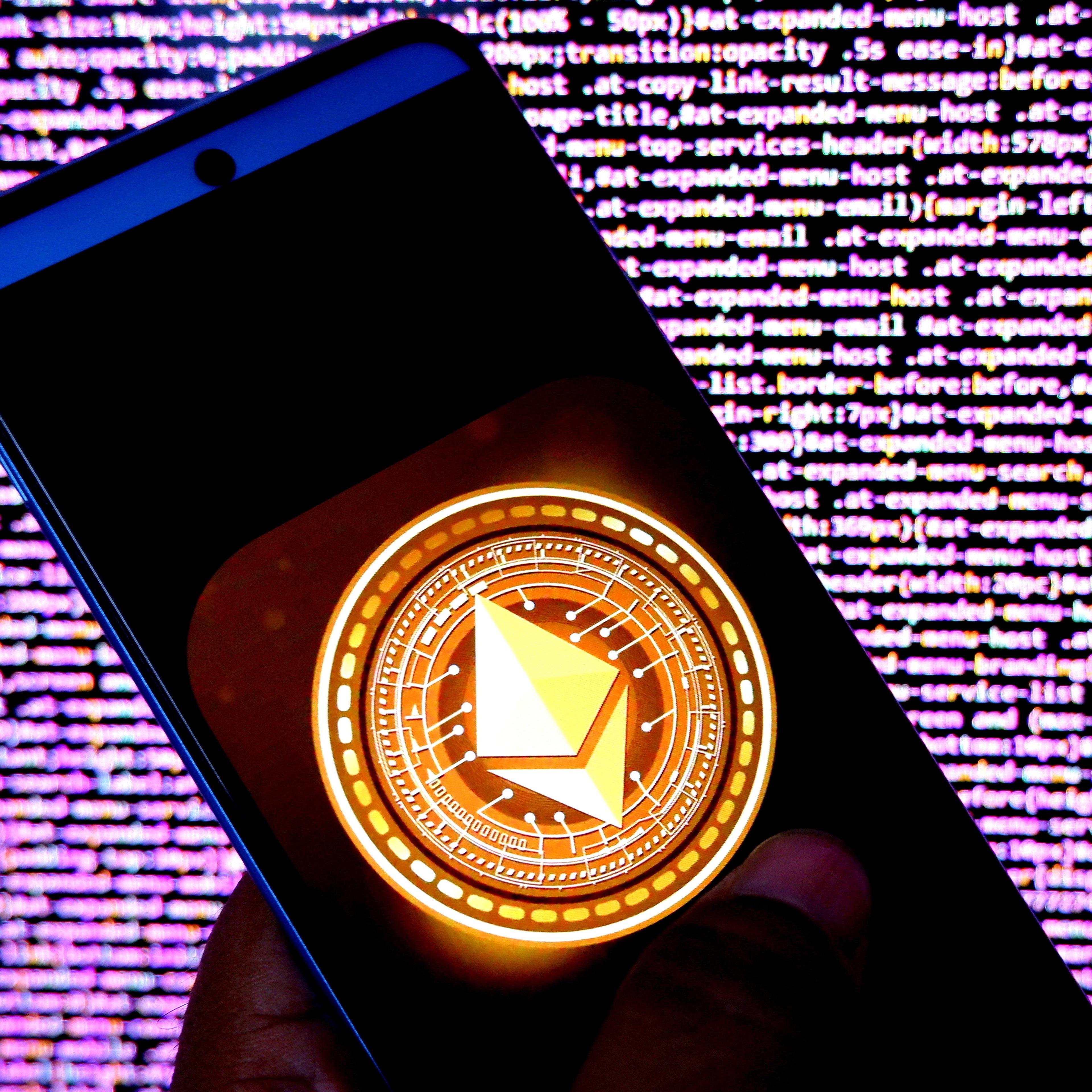 In this photo illustration, an Ethereum logo seen displayed
